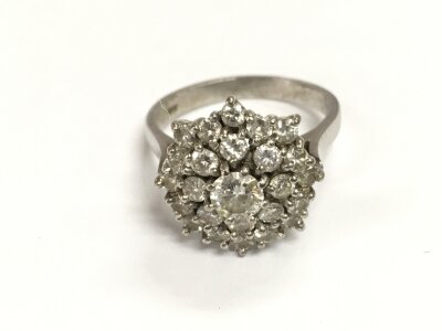 An 18ct white gold diamond cluster ring.