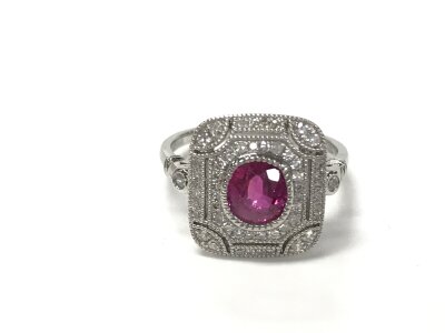 A platinum vintage style panel ring set with Ruby and diamonds with millegrain detailing. Rubies 1.04ct and diamonds 0.24ct. Size L 1/2.
