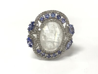 Silver dress ring set with oval rainbow moonstone pear and round cut tanzanite and diamonds. Moonstone 6.70ct size N