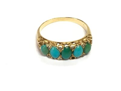 An unmarked gold ring set with turquoise and diamond chips, approx 4g and approx size O-P.