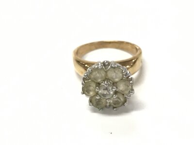 A yellow metal ring with a pattern of white stones. Size N and 5.11g