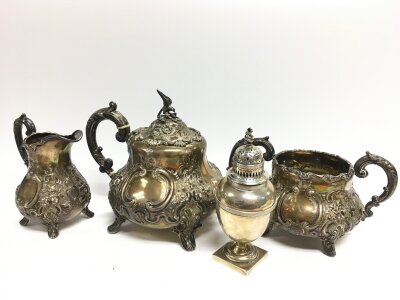 A three piece silver hallmarked tea set and a silver sugar caster. 13 to 19cm tall