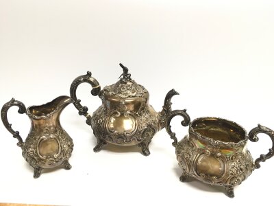 A three piece silver hallmarked tea set  13 to 19cm tall. 1455g total weight