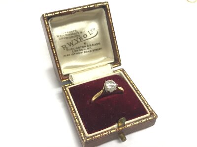 A single stone brilliant cut diamond ring with white gold collet yellow under bezel and shank all in 18ct diamond 0.81 carat , colour C-H. Clarity V.S. 2.7g total weight. Size L