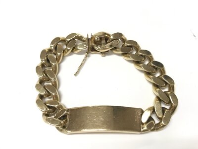 A heavy 9ct gold ID bracelet. 100.70g