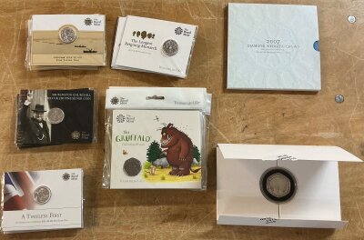 4 royal mint collection coins ( The gruffalo 20th anniversary 50p coin pack from royal mint(UK)). The coin, a standard UK 50 pence struck in cupronickel. Released in 2019. 3 Sir Winston Churchill 2015 UK £20 fine silver coins(999 fine silver(1/2 Troy ounce pure silver). 4 royal mint collection coins( The longest reigning monarch) 2015 UK £20 pound silver coin struck in 999 fine silver (1/2 Troy ounce). 3 royal mint collection coins, a Timeless First(the George and the Dragon 2013 UK £20 fine silver coin(very first legal tender silver coin struck in 999 fine silver, 1/2 trout ounce pure silver. 4 royal mint fine silver £20 pound fine silver coin( commemorates the 100th anniversary of the 1st world war(1914-1918). The coin design features Britannia alongside military and naval imagery marking the conflict. Struck in 999 fine silver(1/2 Troy ounce pure silver).The Royal Mint, 5 pound .925 sterling silver content, features dual portraits of Elizabeth II and Prince Phillip, with their names inscribed around the edge, plus symbols representing their life and service. A popular royal commemorative issue, struck  to honour the longest marriage of any British monarch. It ho,.do both its silver content value and a collector premium for its theme and proof quality. A 2007 UK £5 Crown coin, issued by the Royal Mint to mark the Diamond Wedding Anniversary of Queen Elizabeth II and prince Phillip(6