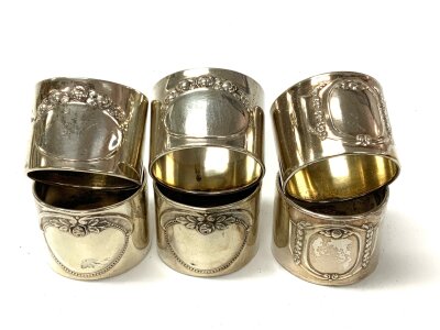 3 pairs of .800 silver napkins rings each with embossed floral design.