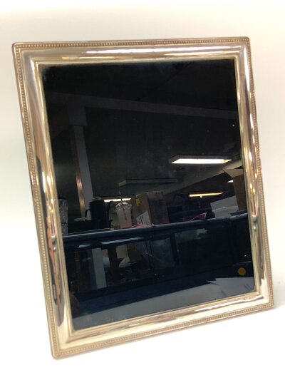 A modern hallmarked silver photo frame 29cm x 24c,m