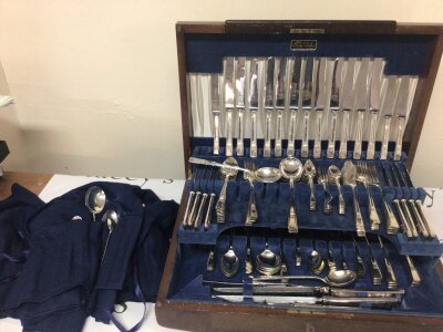 A Sheffield mid 20th century silver plated cutlery set maker Priestley & Moore Ltd and a quantity of silver plated cutlery in blue cloth storage bags maker Mappin & Webb