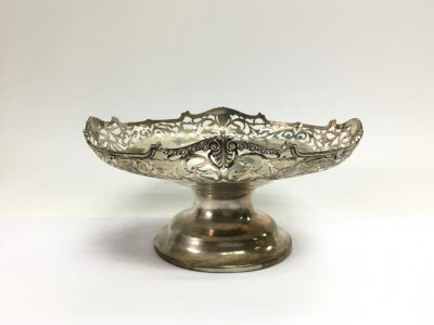 A silver dish with a pierced edge, Birmingham hallmarks, approx height 10cm and approx 324g.,