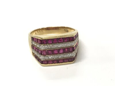 An 18ct Ruby and diamond ring. Size N 1/2 and 5.95