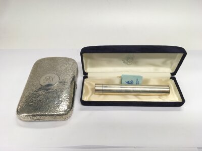 A silver cigar case and one other, approx total weight 188g.