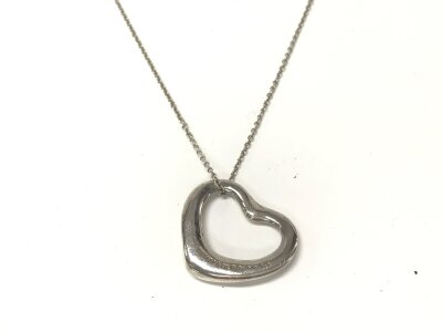 A Tiffany and Co Silver heart pendant band chain.