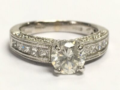 A 14ct white gold ring central stone brilliant cut diamond (0.82 to shank mark). Size M, 4.7g