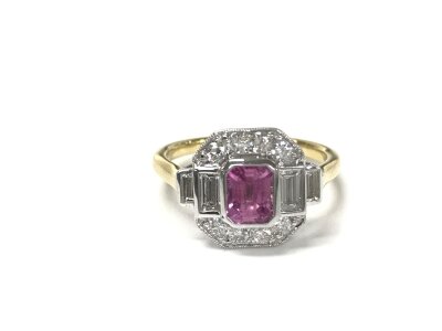 An 18ct yellow and white gold art deco style ring set with pink sapphire and diamonds. Comes with cert. Size N 1/2