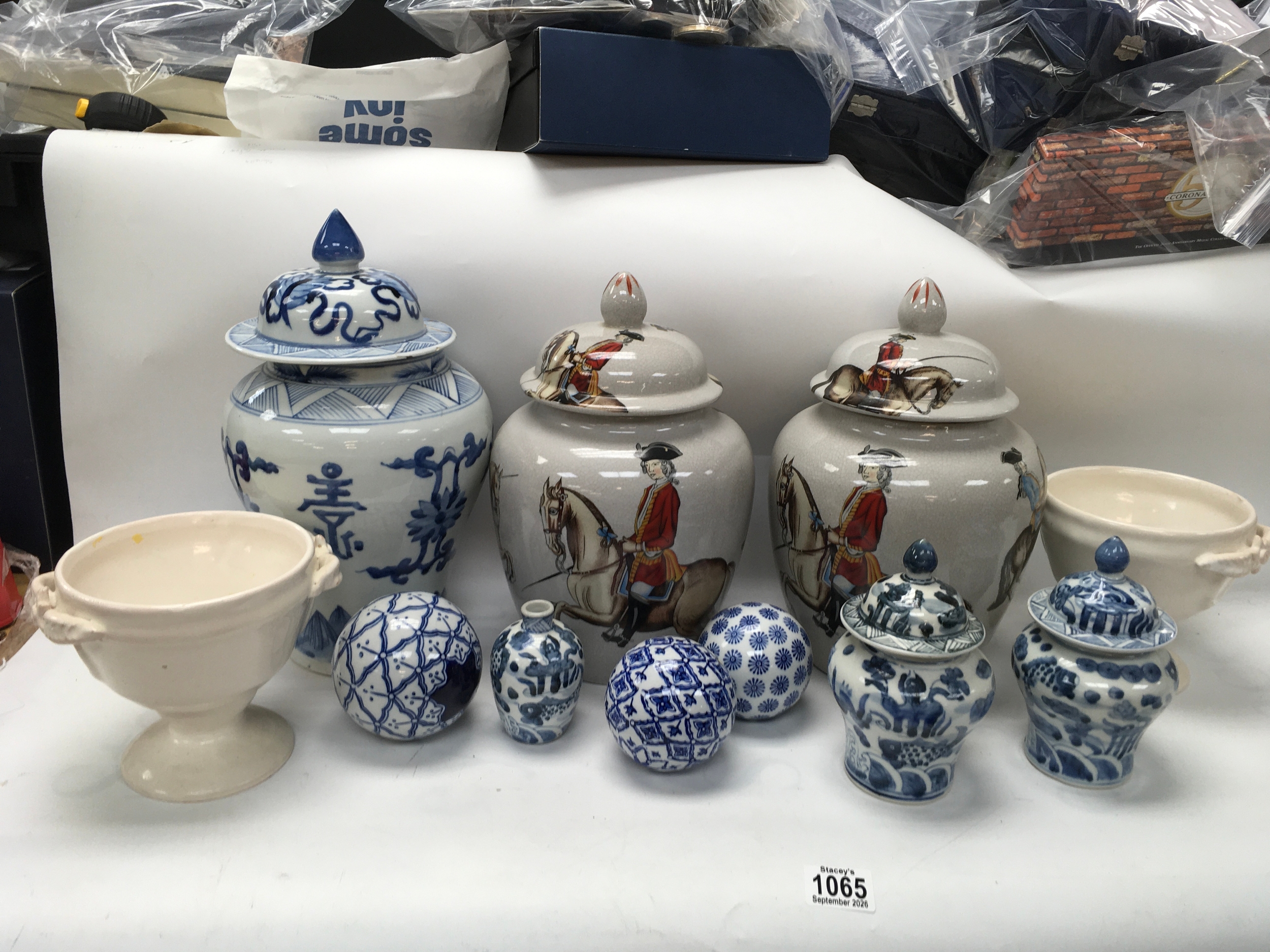 A collection of ceramics including horse vases and China wear. 