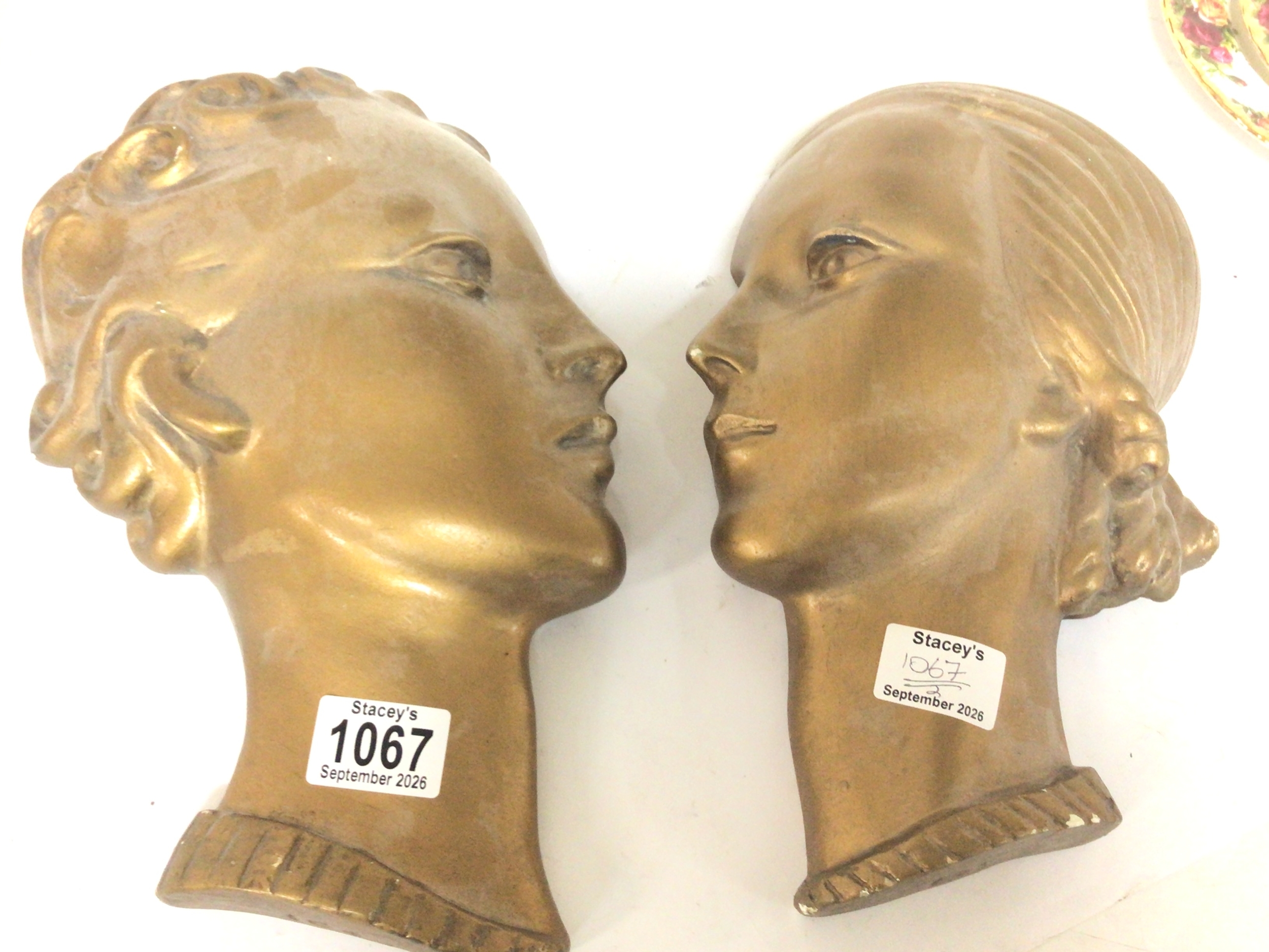 Two Art Deco influence gold painted wall masks 31cm 