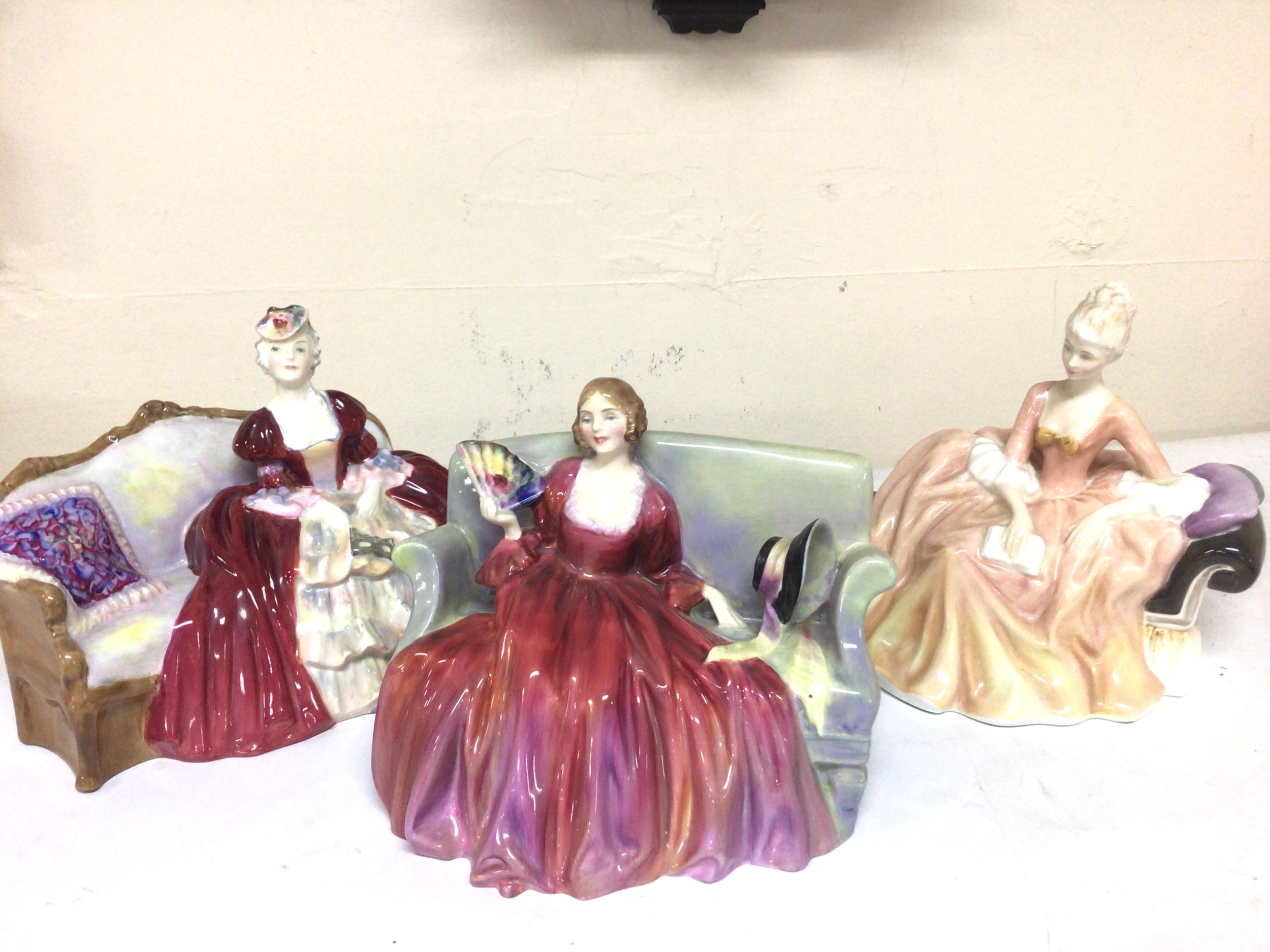  Three Royal Doulton lady figures seated on sofas sweet & Twenty Bell O the Ball and Reverie no obvious damage (3)