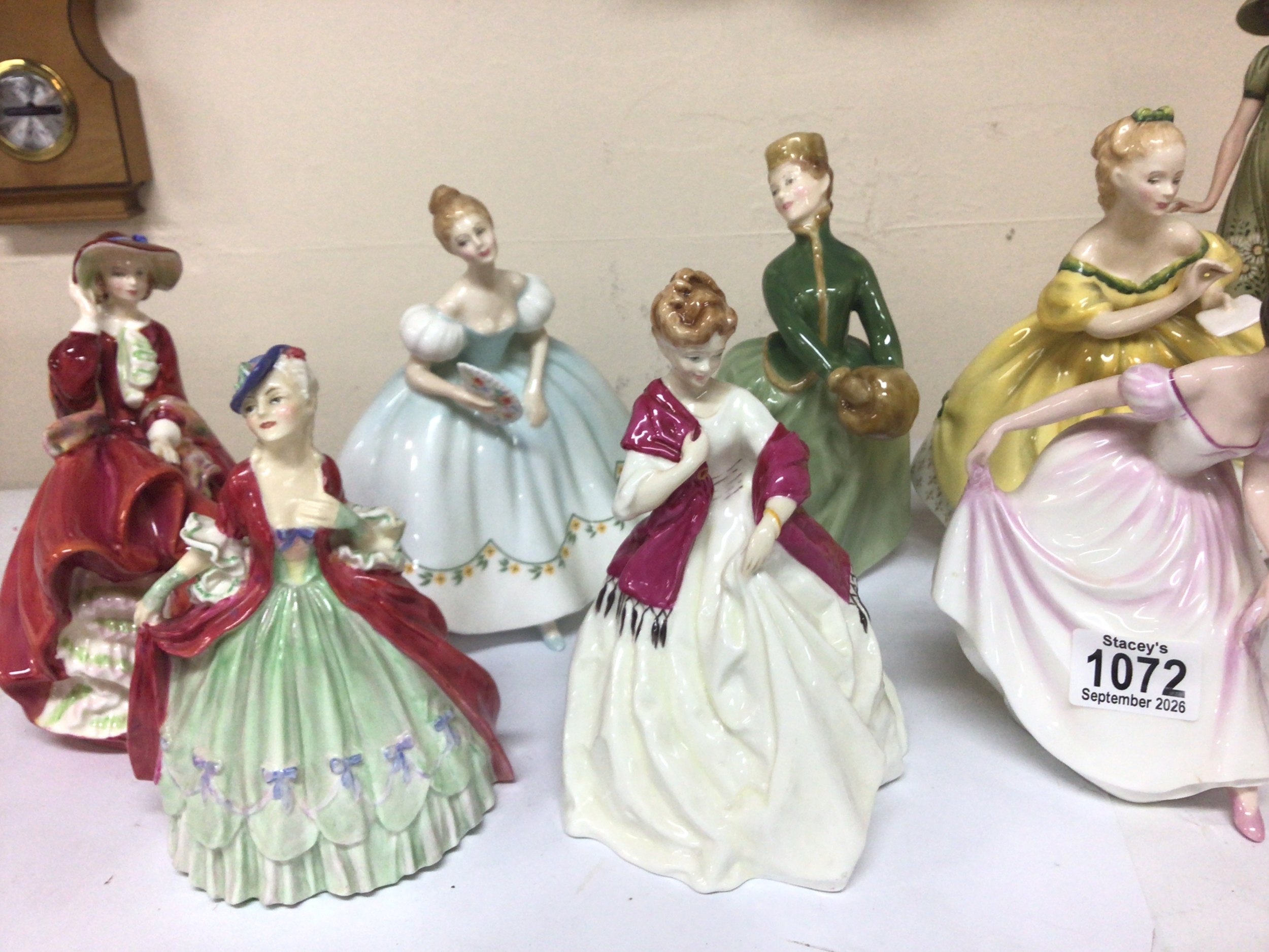  A collection of ten Royal Doulton lady ceramic figures. 