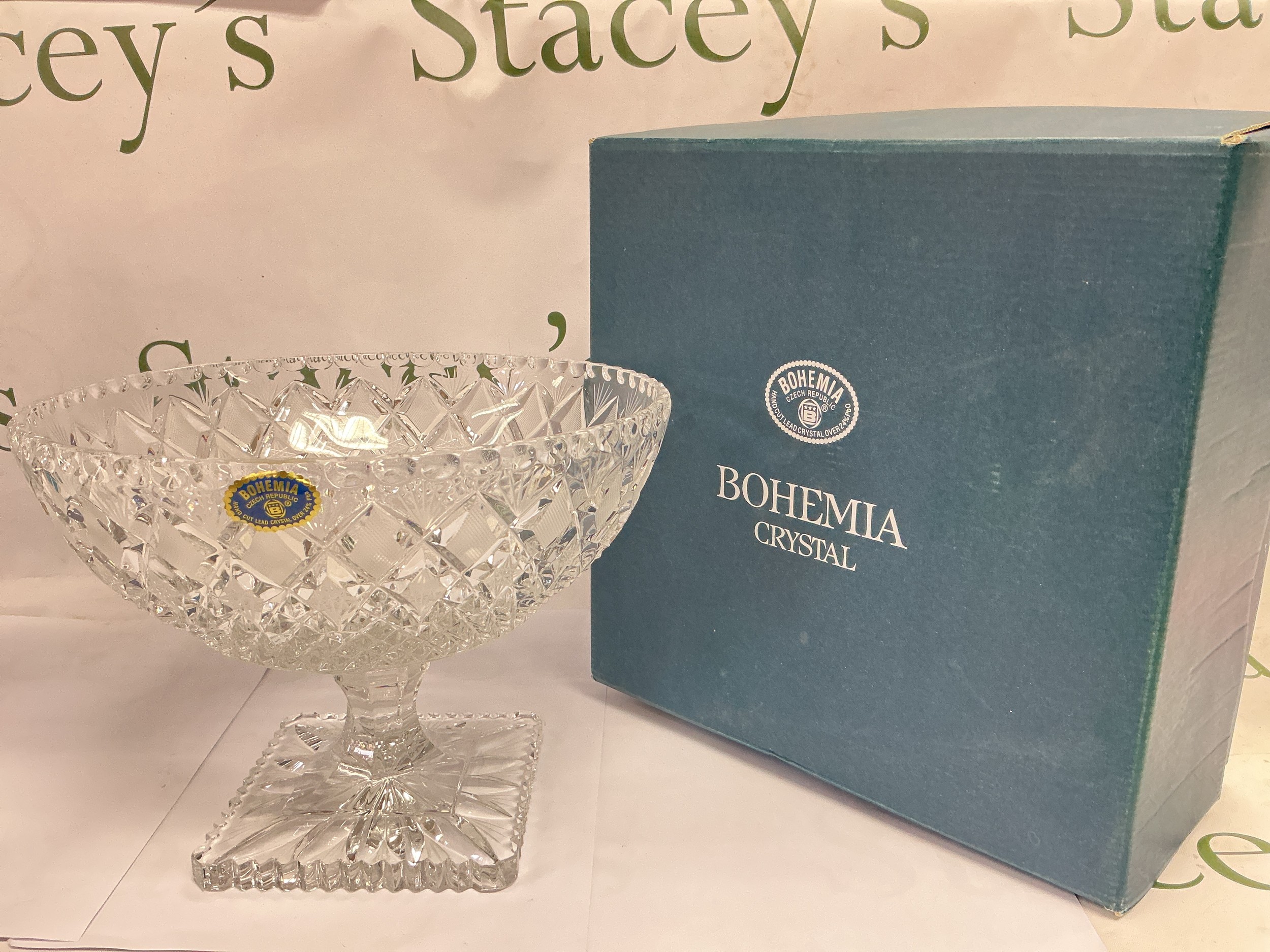A boxed Bohemia crystal bowl on a square cut base, approx height 19cm.