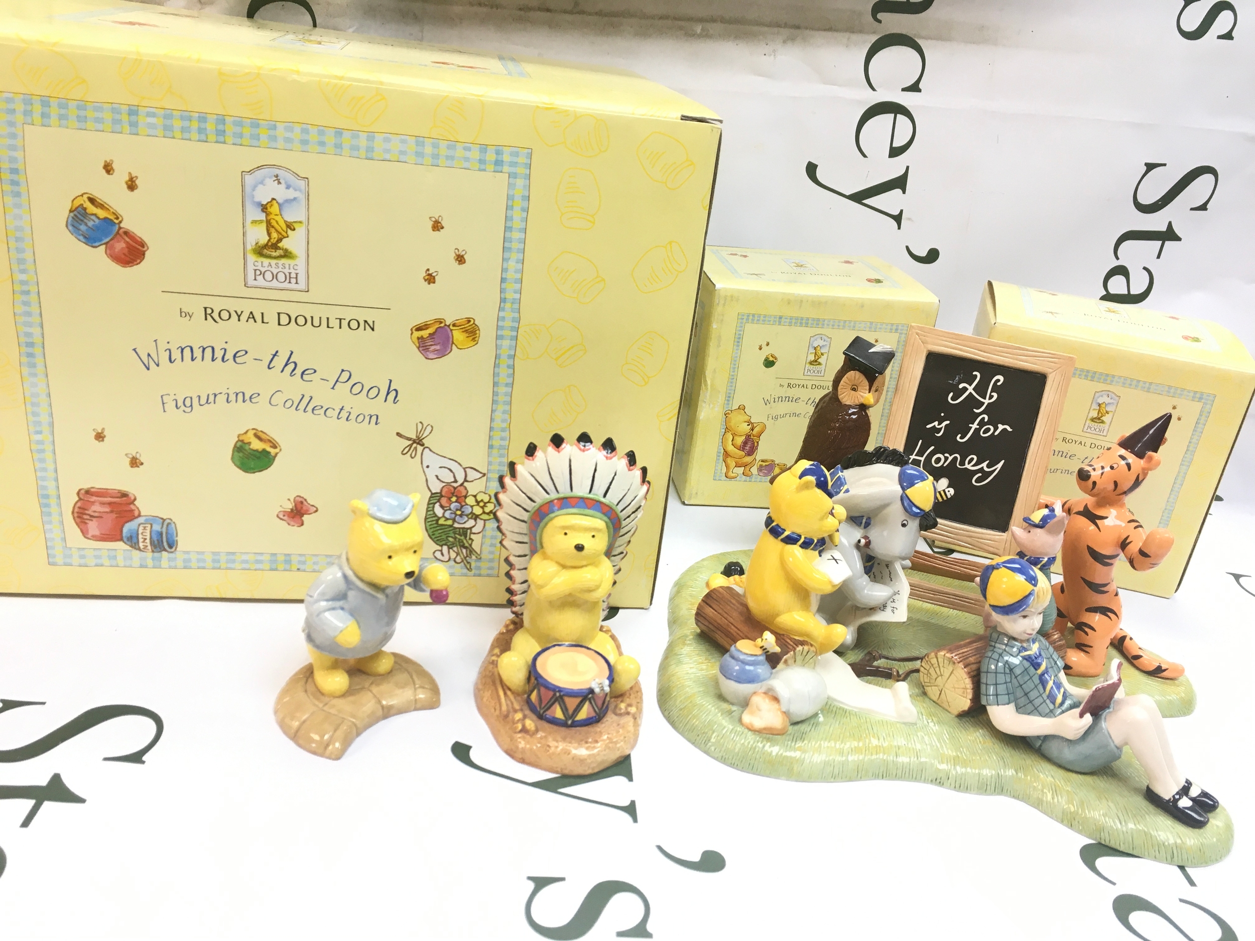 3 boxed Winnie The Pooh ceramic figures (1 large, 2 small)