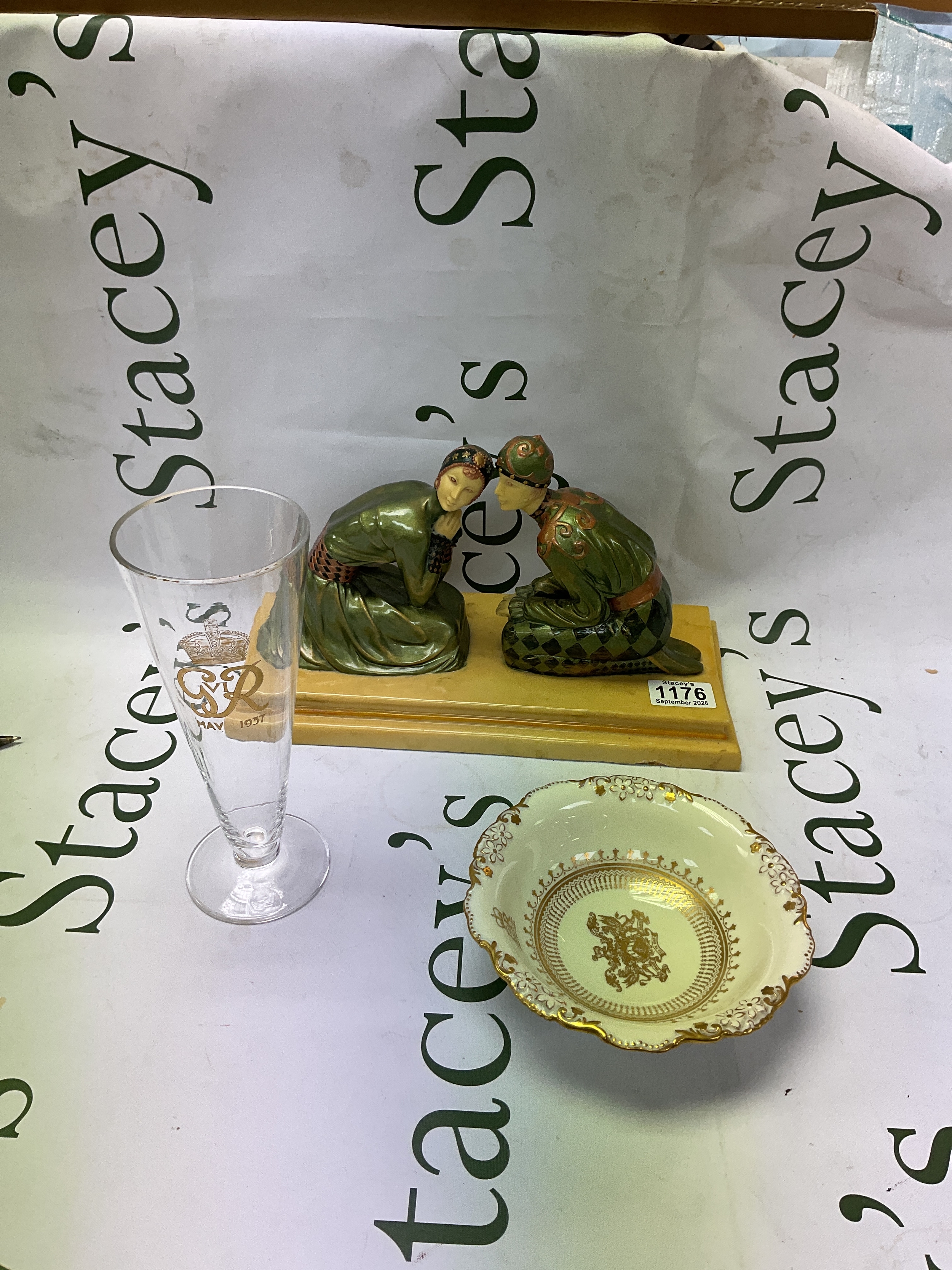 Royal ephemera a GVIR glass, an EIIR gilt bowl by Spode and a modern Art Nouveau style pair of kneeling figurines after Preiss/Chiparus.