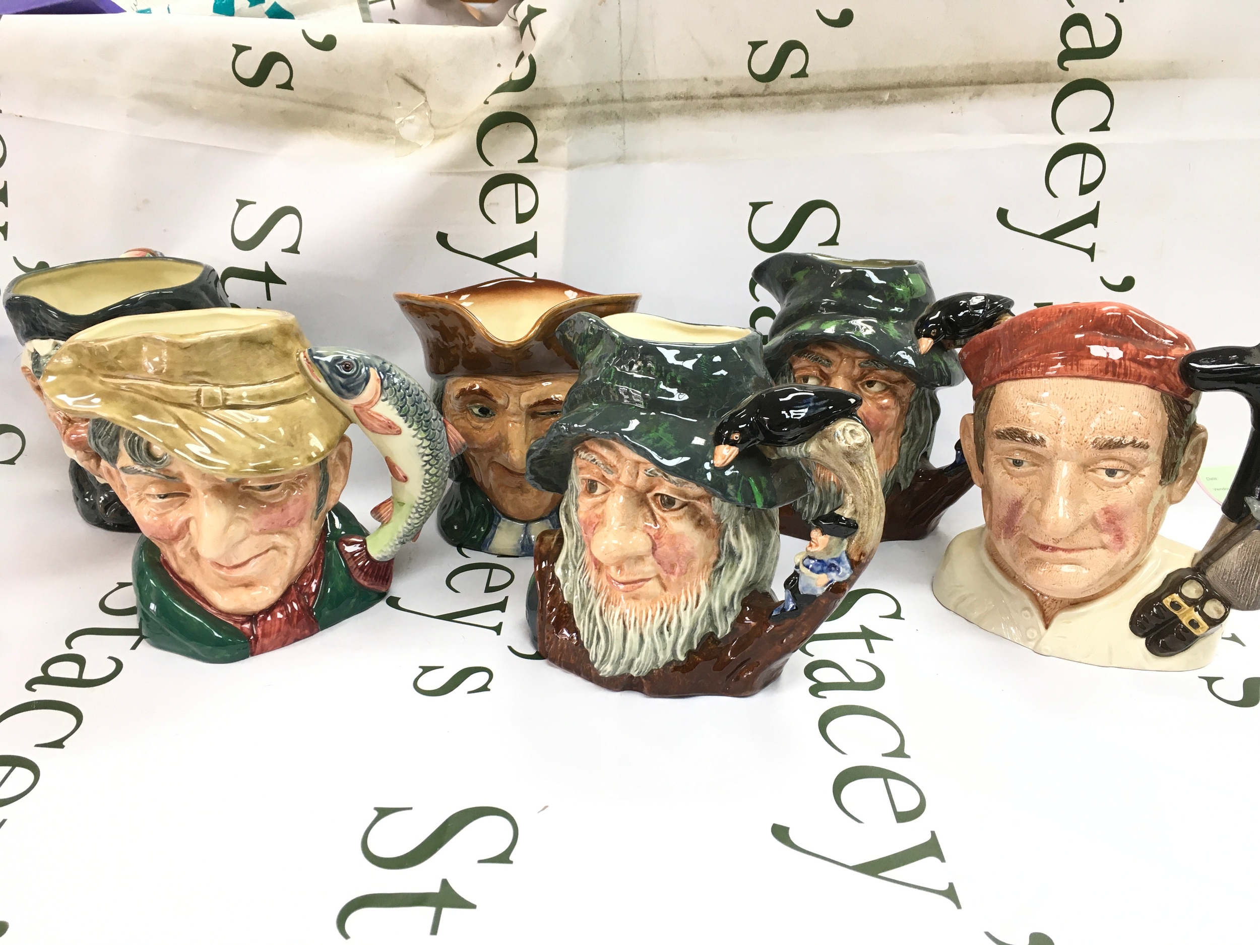 Six Royal Doulton character jugs including Rip Van Winkle, Bootmaker, Vicar of Bray