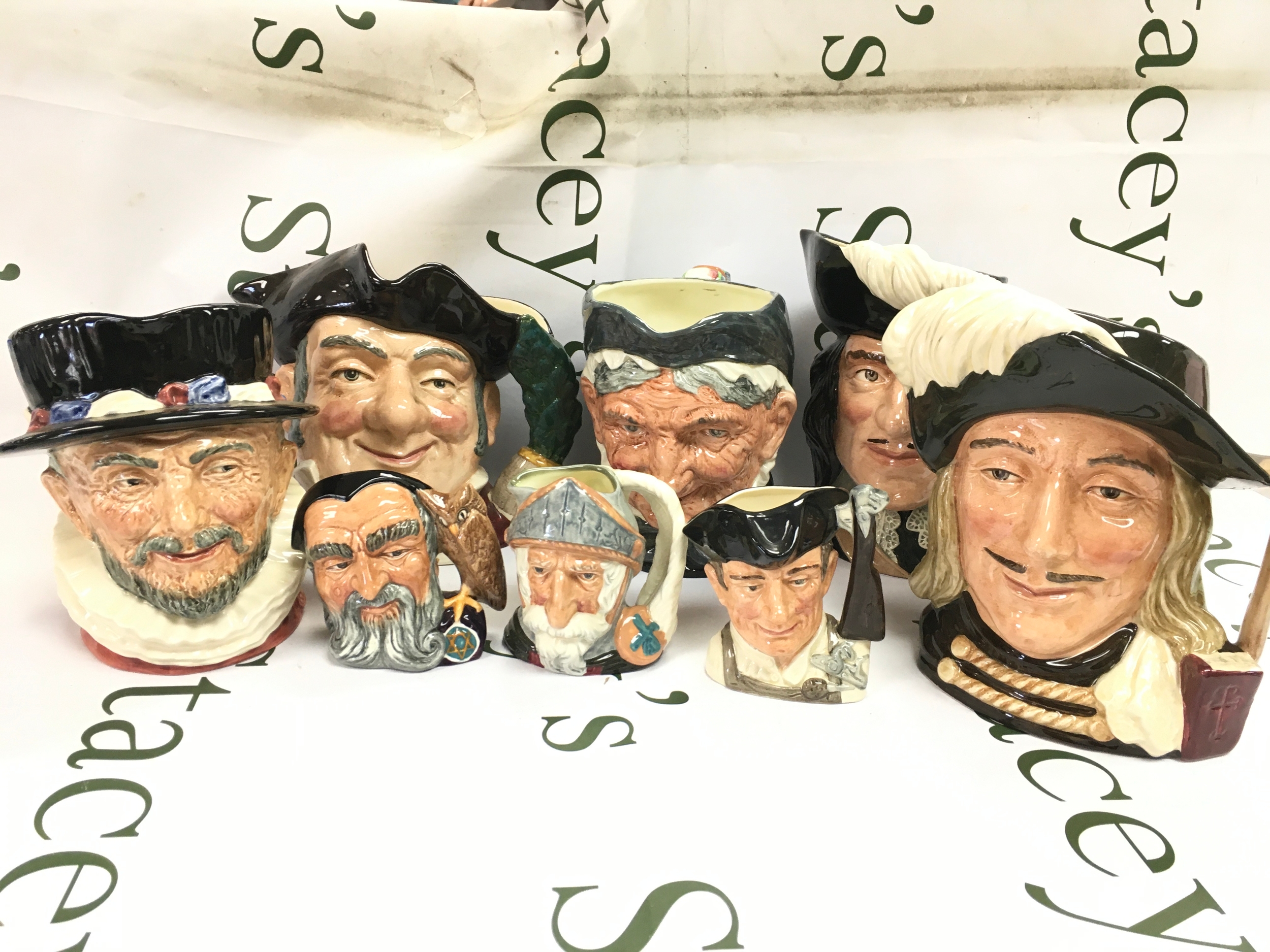 Eight Royal Doulton character jugs. Aramis , Beefeaters, Gunsmith 