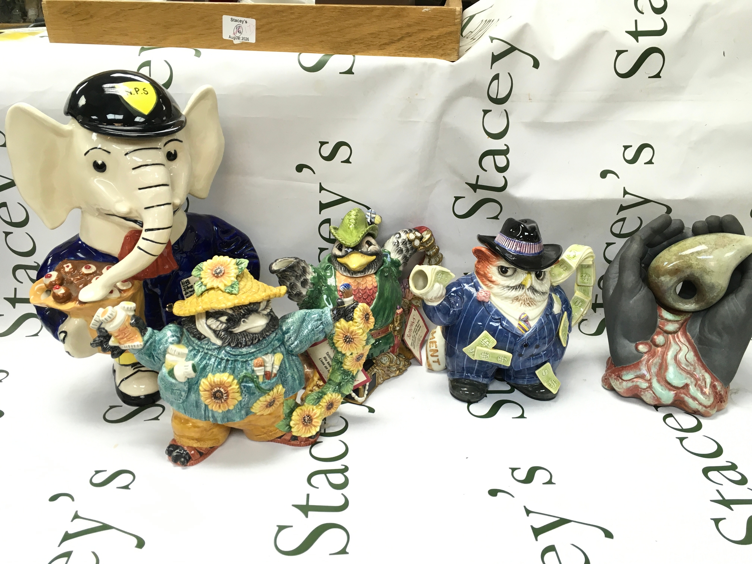 Four ceramic tea pots Fitz and Floyd Robin Hood, Owl Capone, Vincent van crow, Gary Semour elephant, collectors club genesis Paul Cardew hands with shell sculpture
