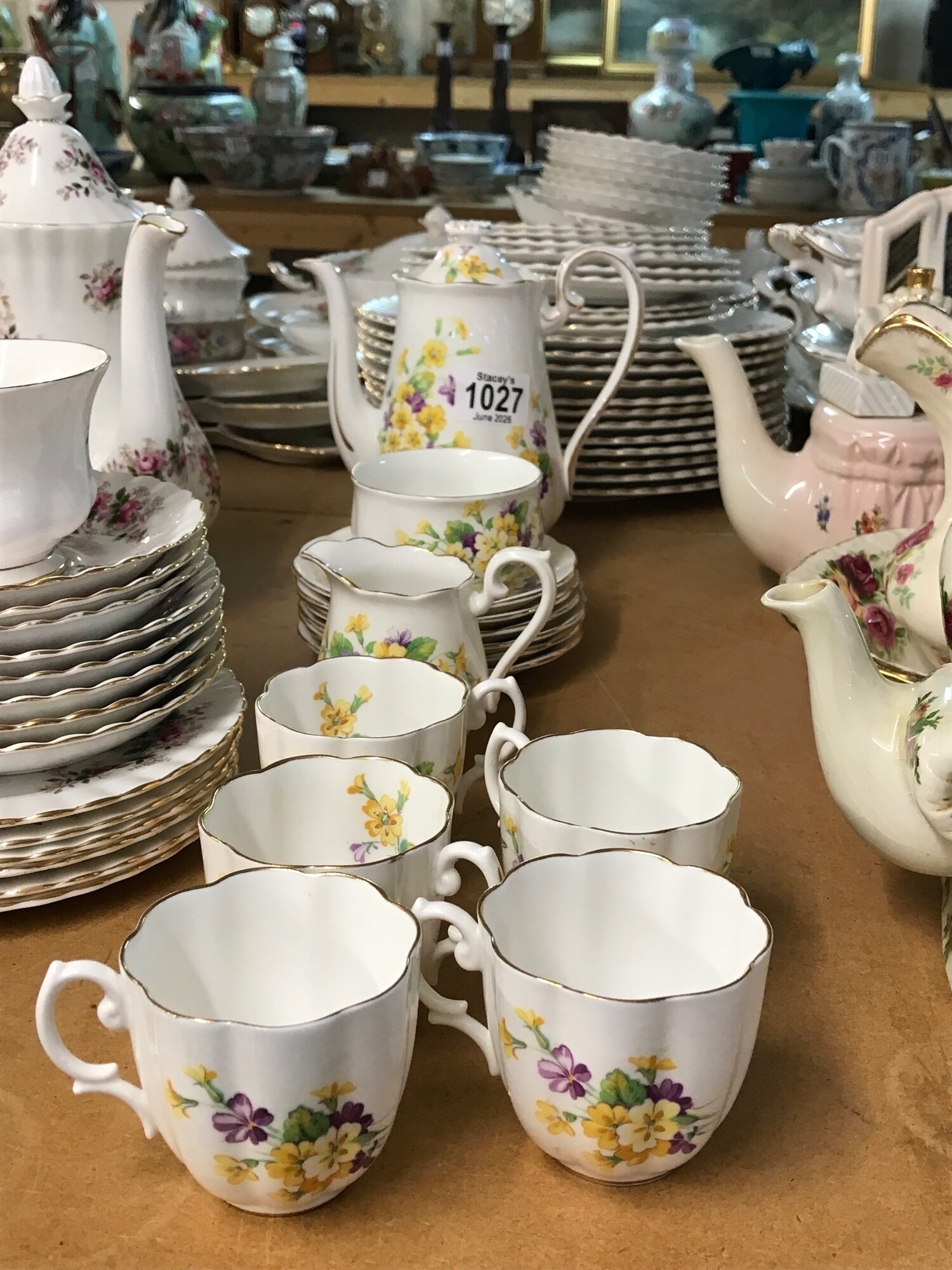 A Royal Doulton bone chine coffee set decorated with flowers, including coffee pot, sugar bowl, cups, cream jug and saucers NO RESERVE