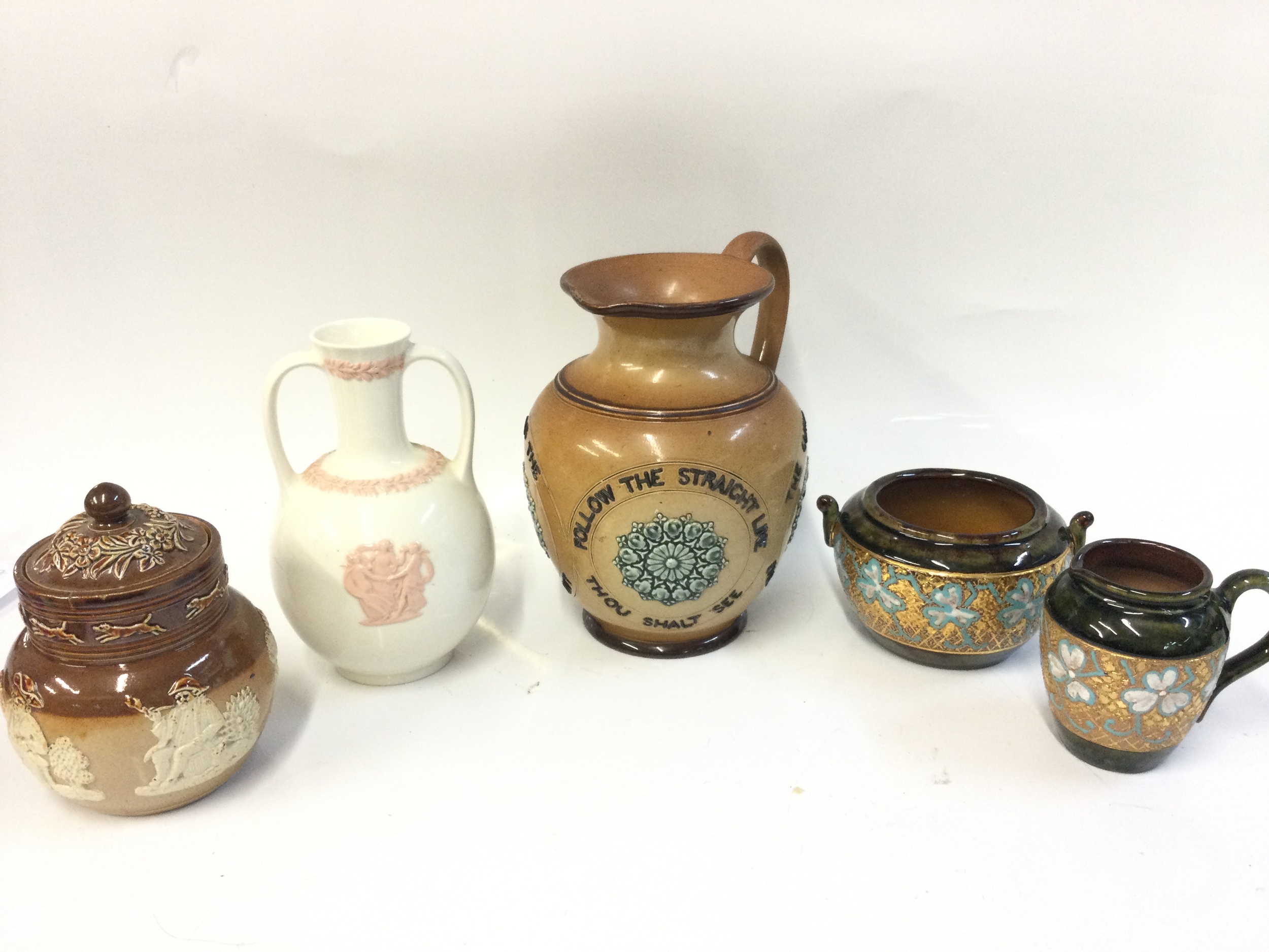 Royal Doulton slater patent stonewear items, 19th-century Doulton Lambeth stoneware motto jug, Wedgwood Queensware trophy vase and a Doulton Lambeth stoneware jug. 8 to 18cm tall NO RESERVE