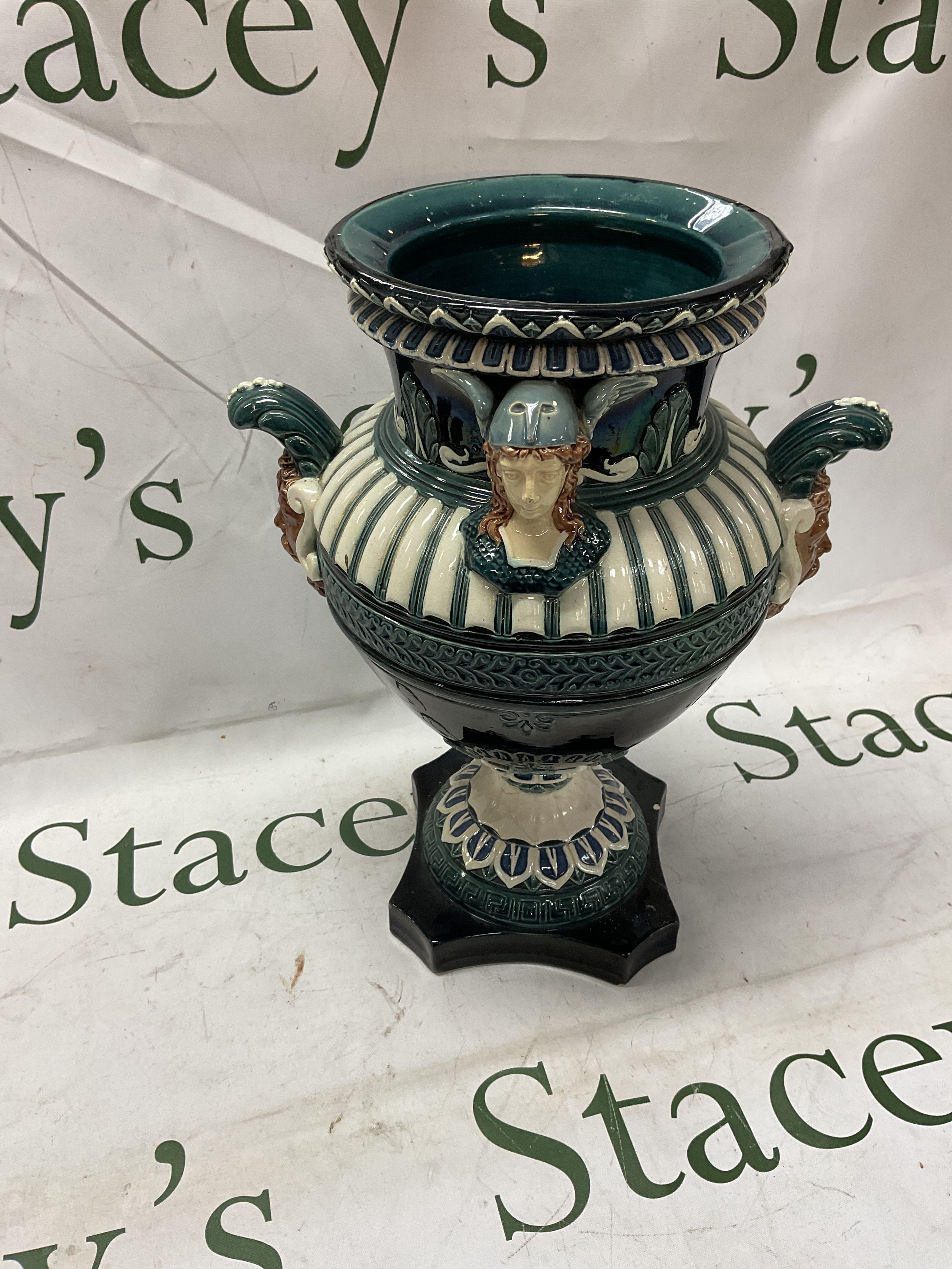 Austrian Gerbing and Stephan Majolica vase, in blues, white and browns, impressive urn vase decorated with heads in winged helmets and faced handles. 30 cm high, marked to the base. NO RESERVE