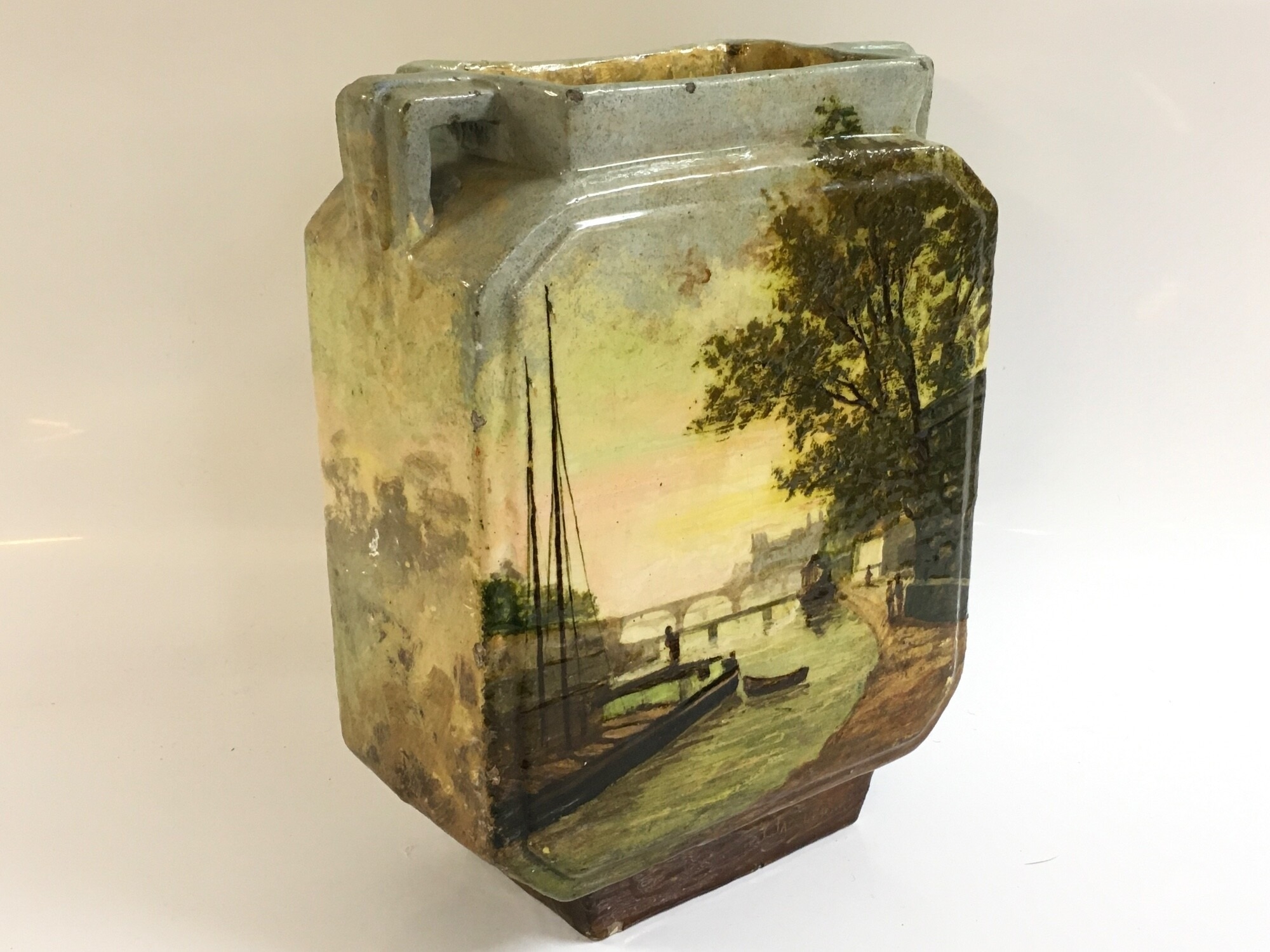 A Continental ceramic vase with a hand painted river scene signed EG for D'Edouard Gilles, 25cm tall 19cm wide. NO RESERVE