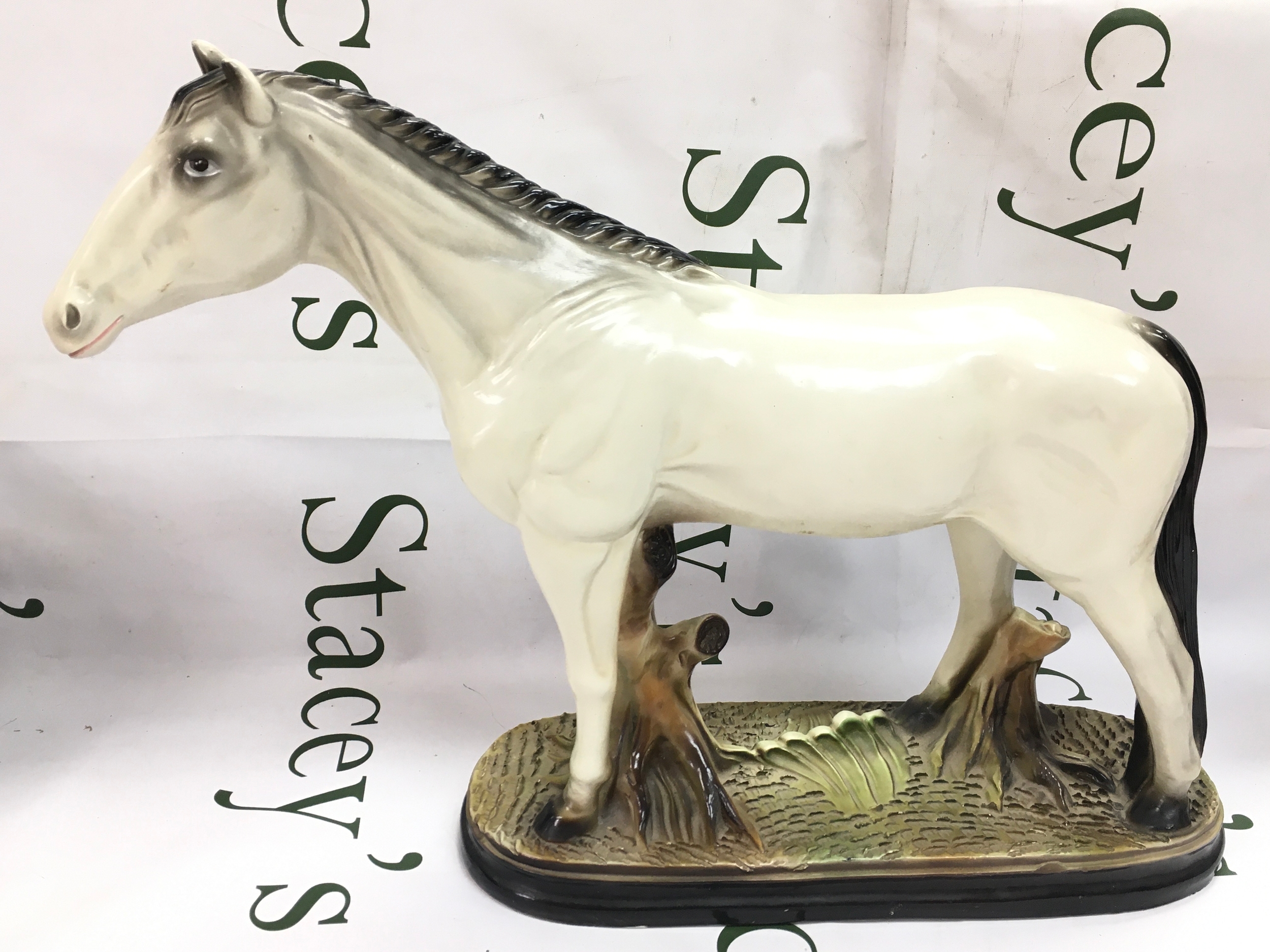 A ceramic horse figure. 34cm tall, 50cm wide. No obvious damage 