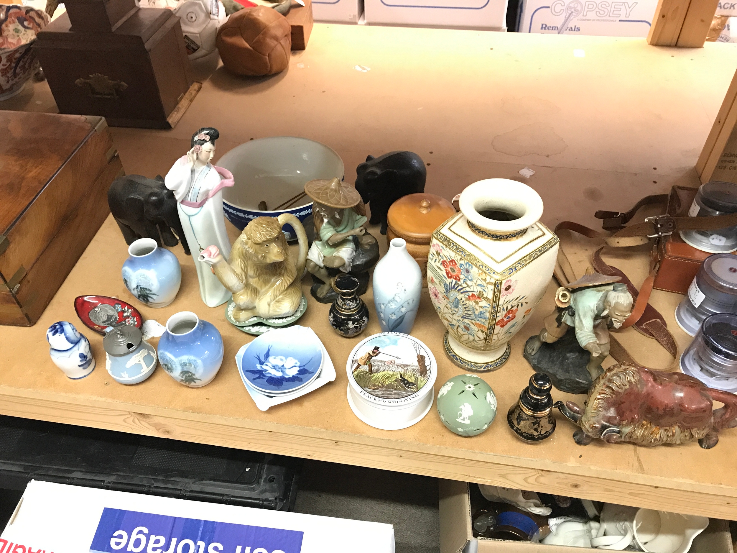 A collection of ceramics including dishes, Wedgwood bowl and green dishes, oriental figures, monkey tea pot etc 