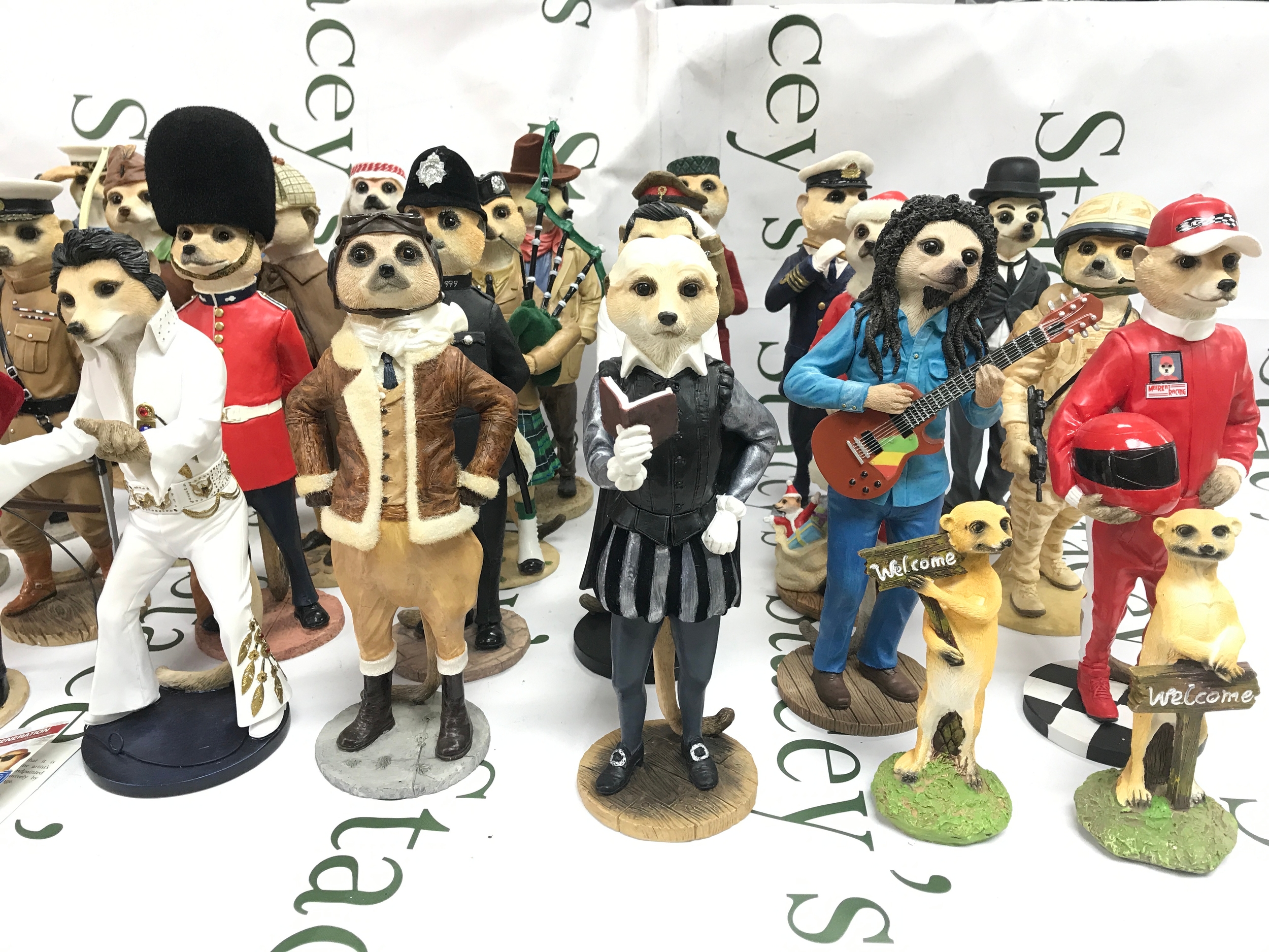 collection of 30+ Country Artists Magnificent Meerkats resin figurines dressed as famous cultural icons and historical figures.