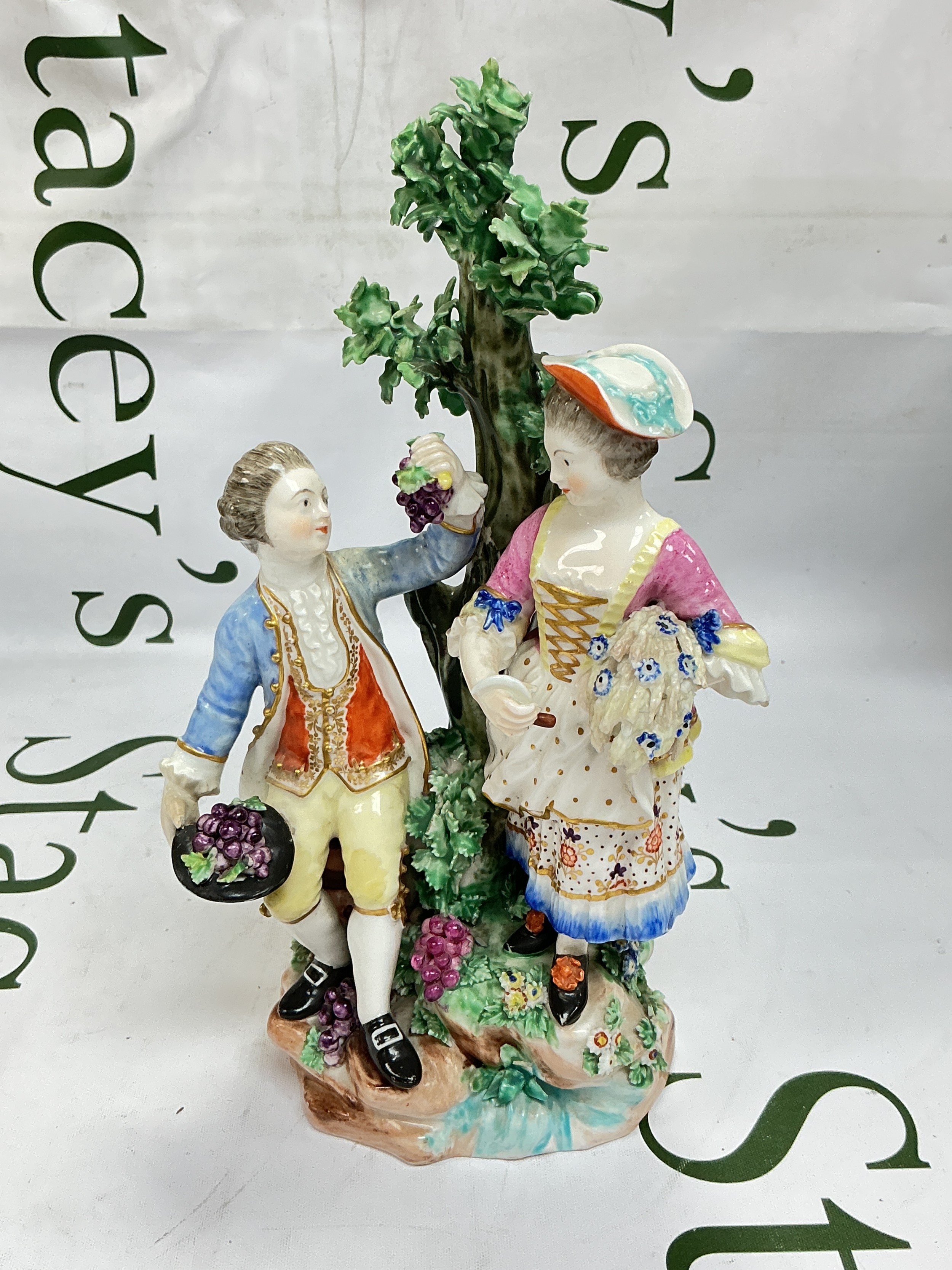 A circa 1770-80 Derby figural group of Summer and Autumn modelled with a gentleman and companion standing beside a tree, incised to base N68, approx 23cm. Minor chips and restoration.