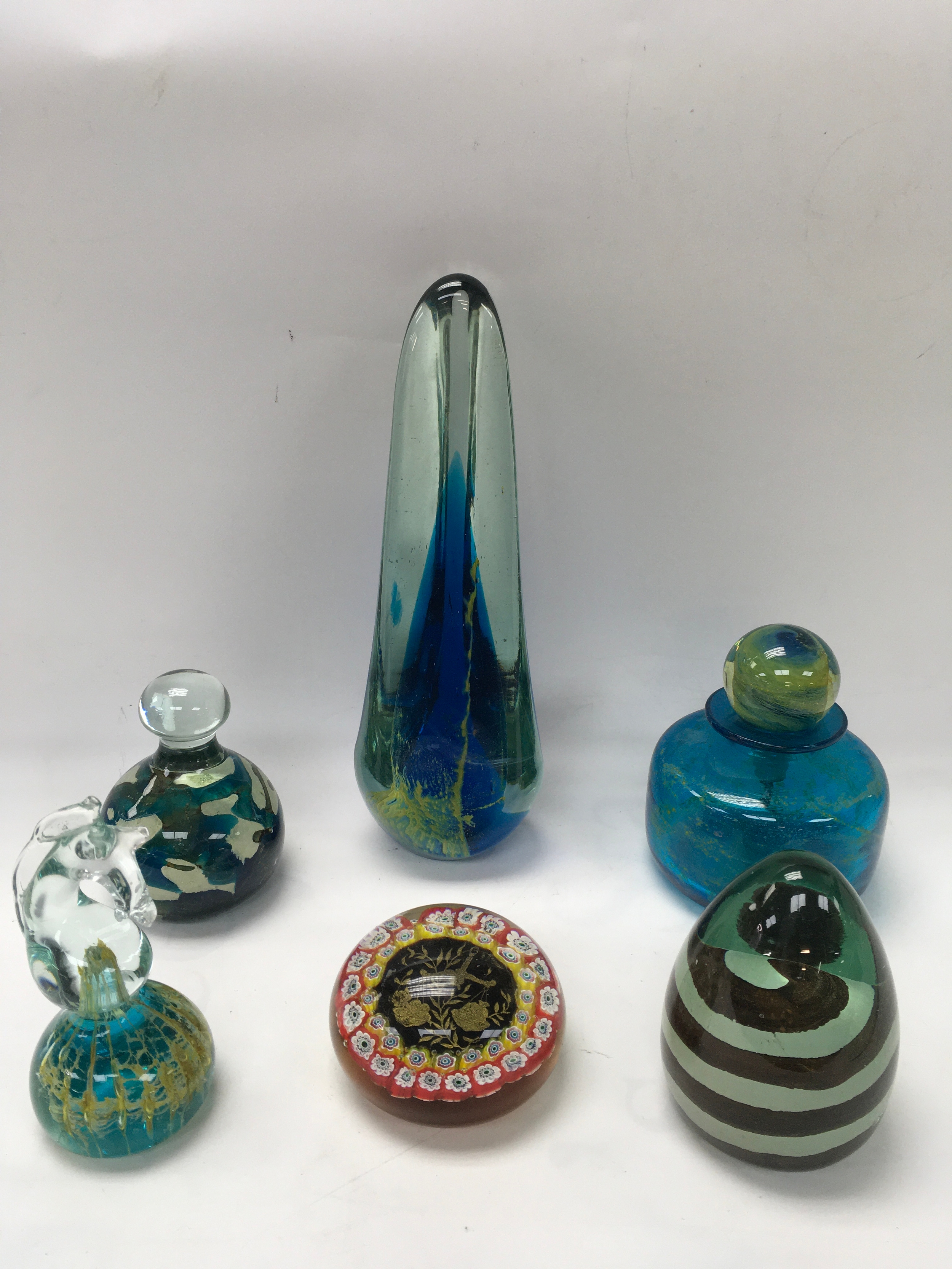 A paperweight depicting Libran star sign having  mille fiori surround, indistinct paper label, plus a small collection of Mdina glass including some signed examples.