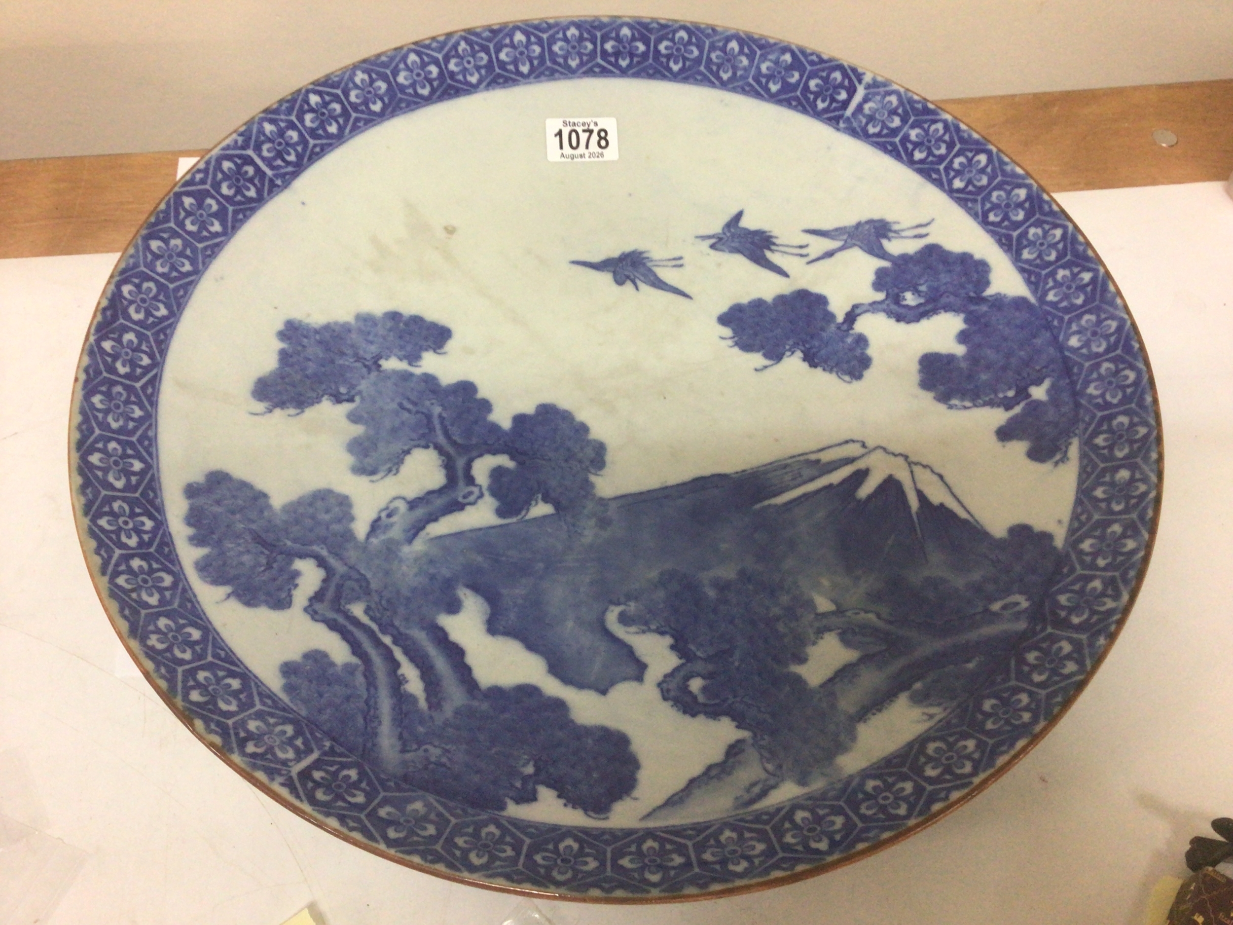 A Japanese blue and white wall charger depicting Mount Fuji with birds and foliage diameter 45cm no obvious damage NO RESERVE