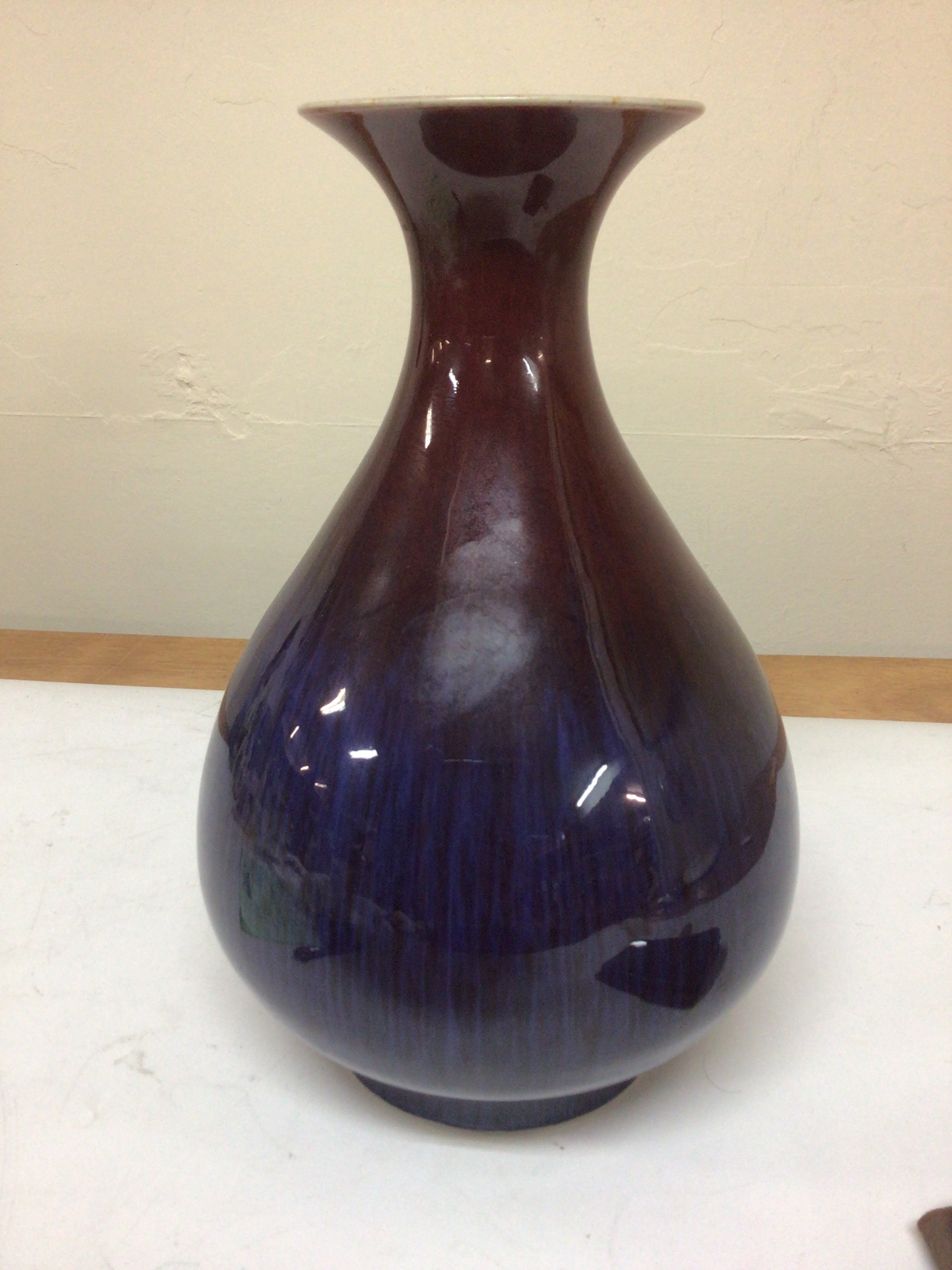 A Chinese Sang de Boeuf Vase of bulbous shape with a two tone glaze caricature marks to the base Republic very good condition no obvious damage hight 29cm