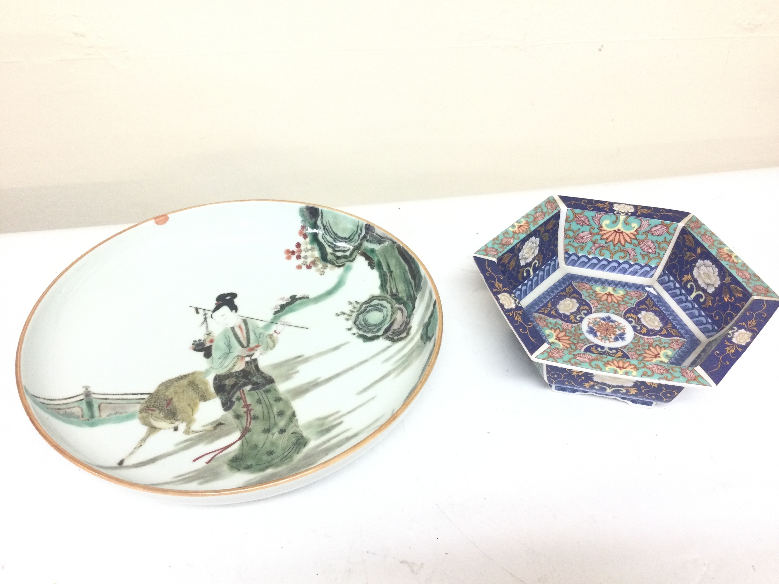Chinese Famille verte style dish and a hexagonal porcelain bowl featuring an intricate multicolor floral pattern.