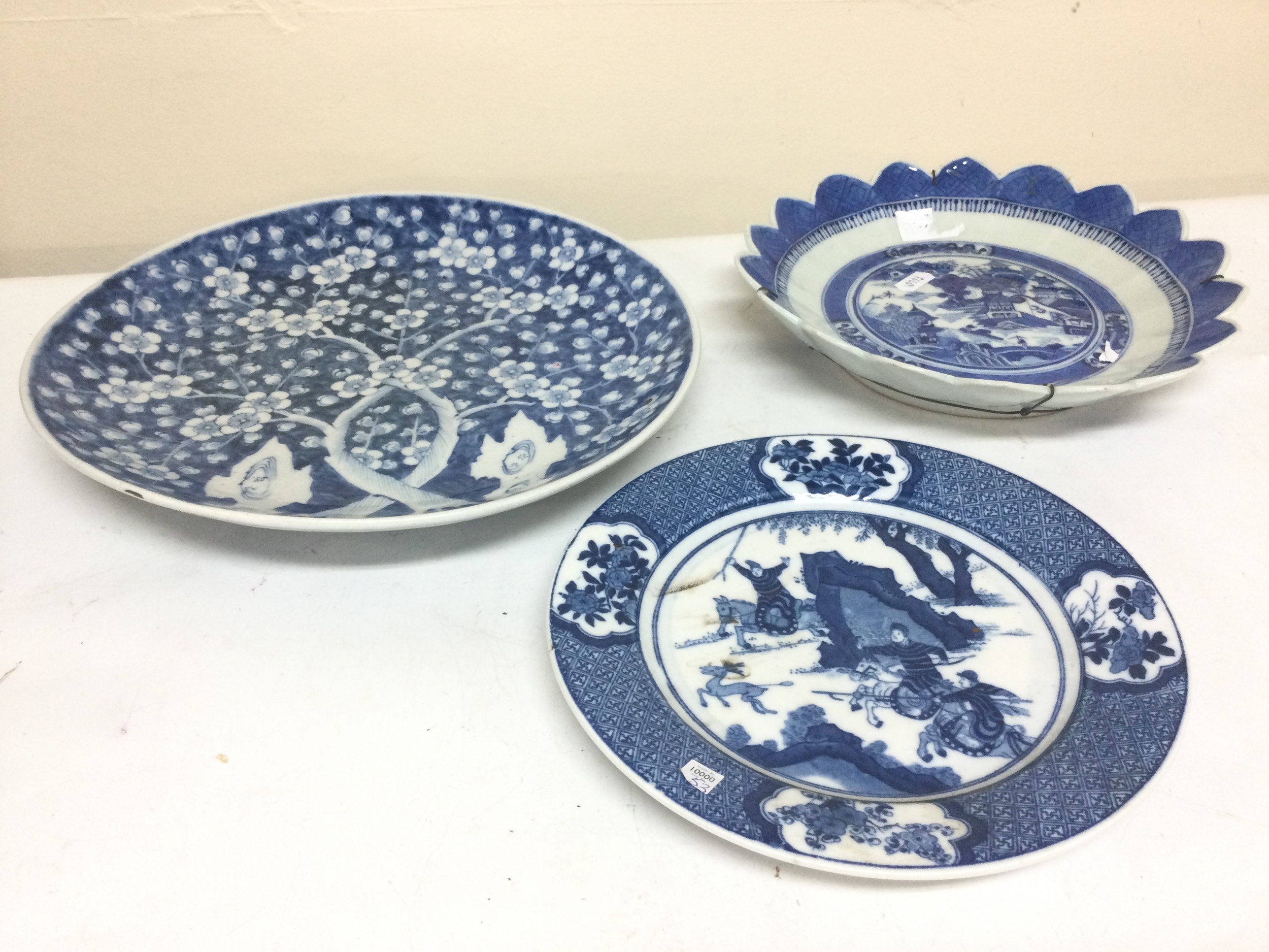 Three Chinese blue and white dishes. 23 to 31cm wide
