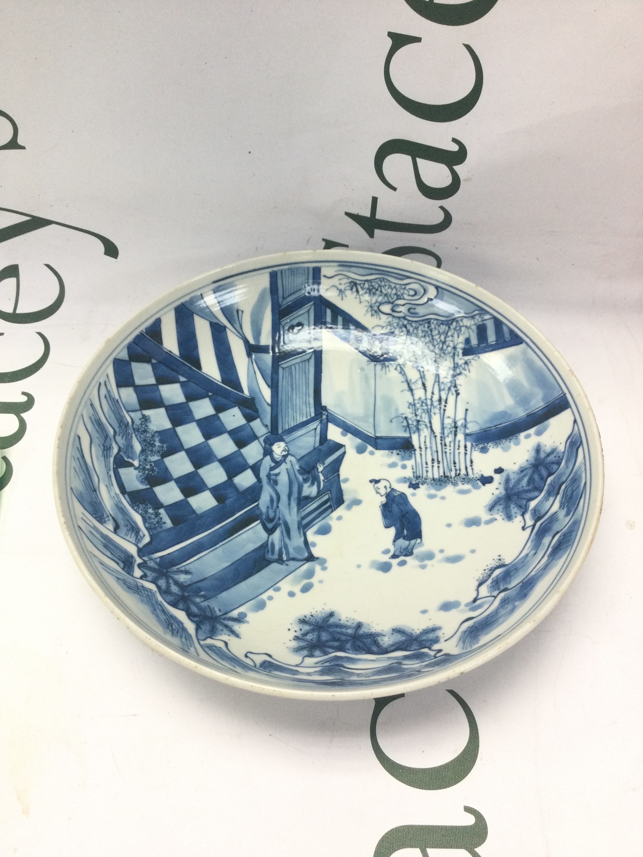 A Chinese blue and white porcelain dish decorated with a figural scene , 22cm wide. No obvious damage or restoration