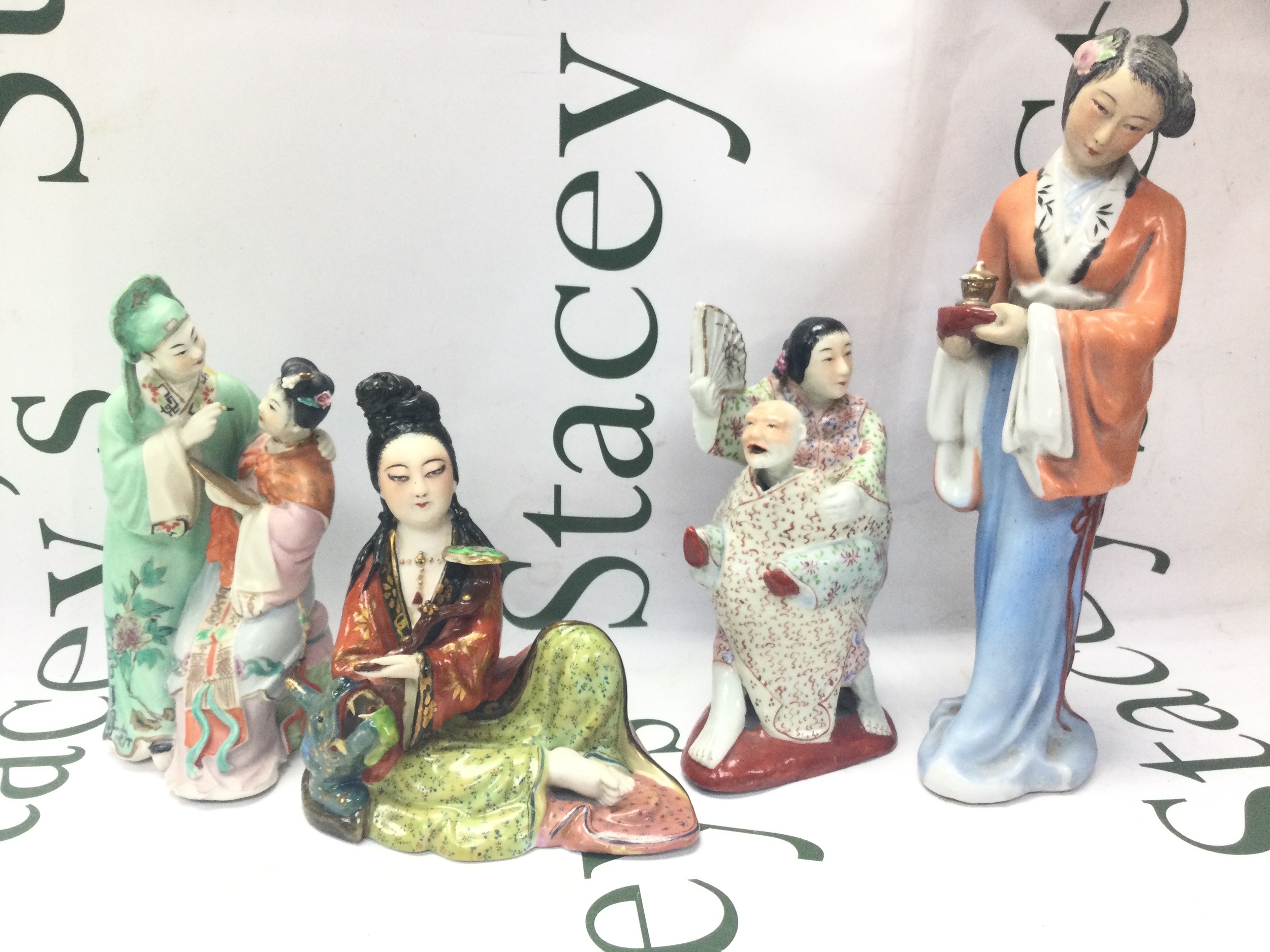 Four Chinese porcelain figures . 13 to 23cm