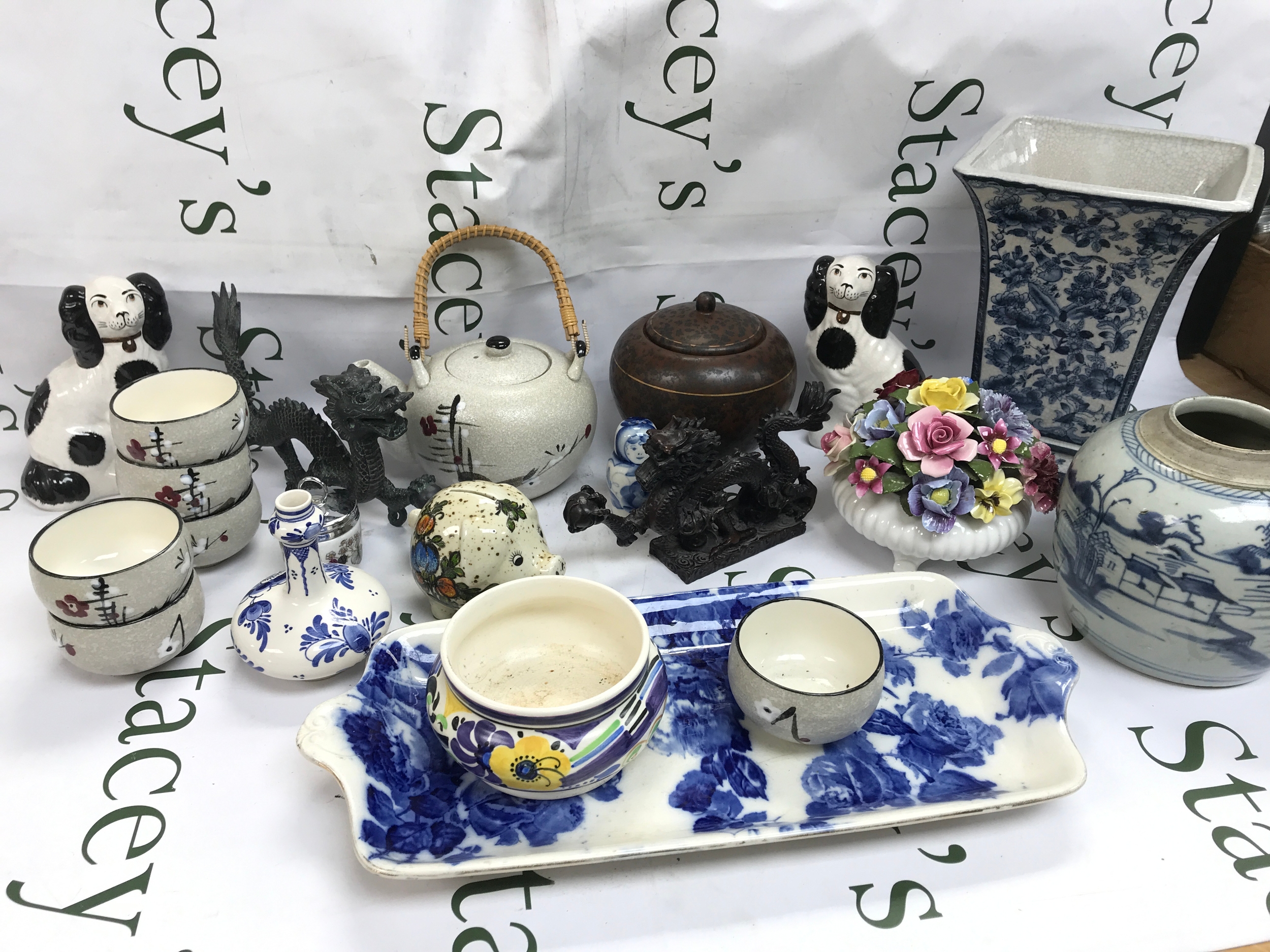 A collection of ceramics including dragon figures, vases, teapots etc 