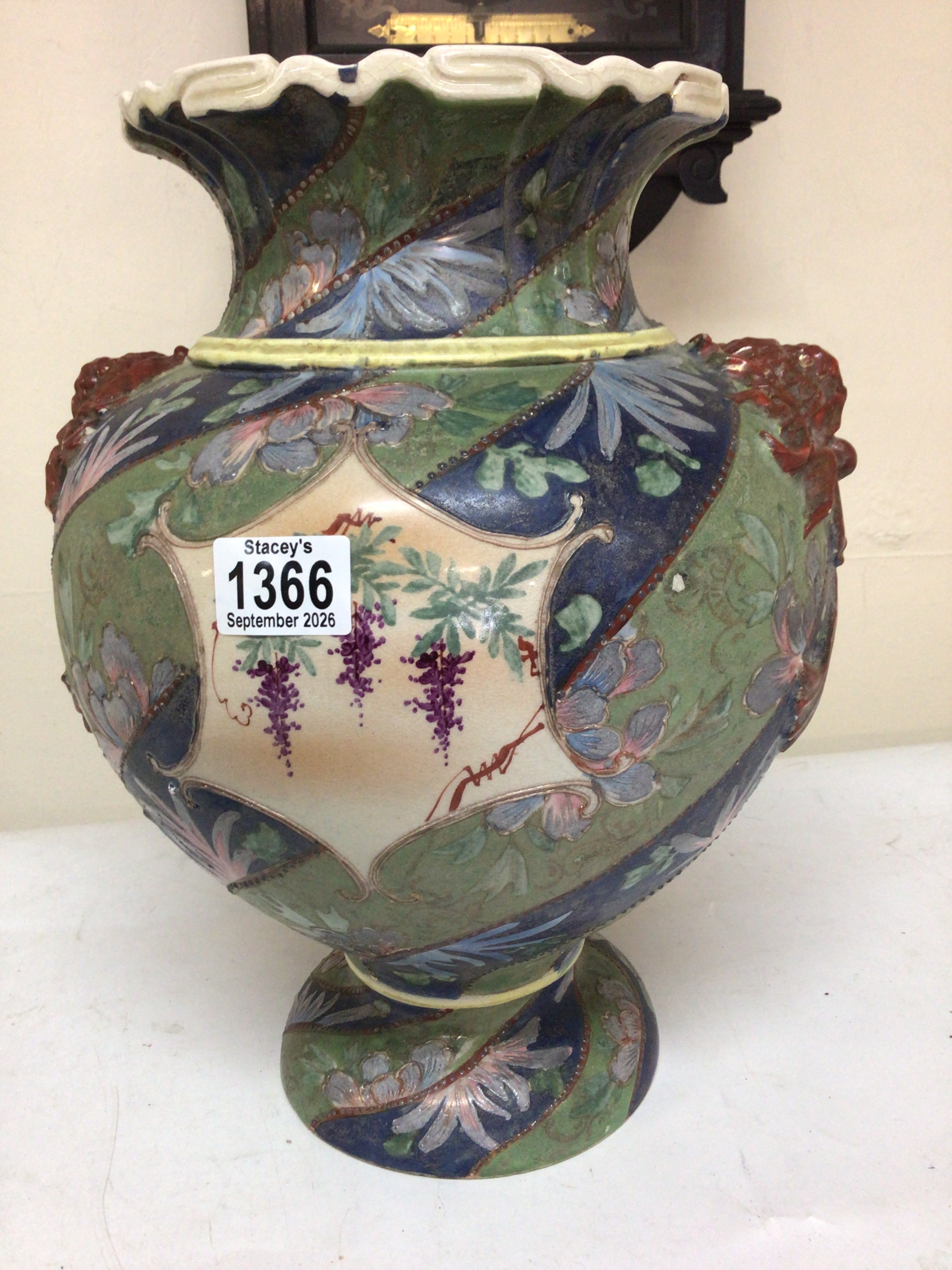 A quality late 19th century Japanese Satsuma Vase decorated with flowers on a blue green ground with raised side mouldings Hight 36cm 
