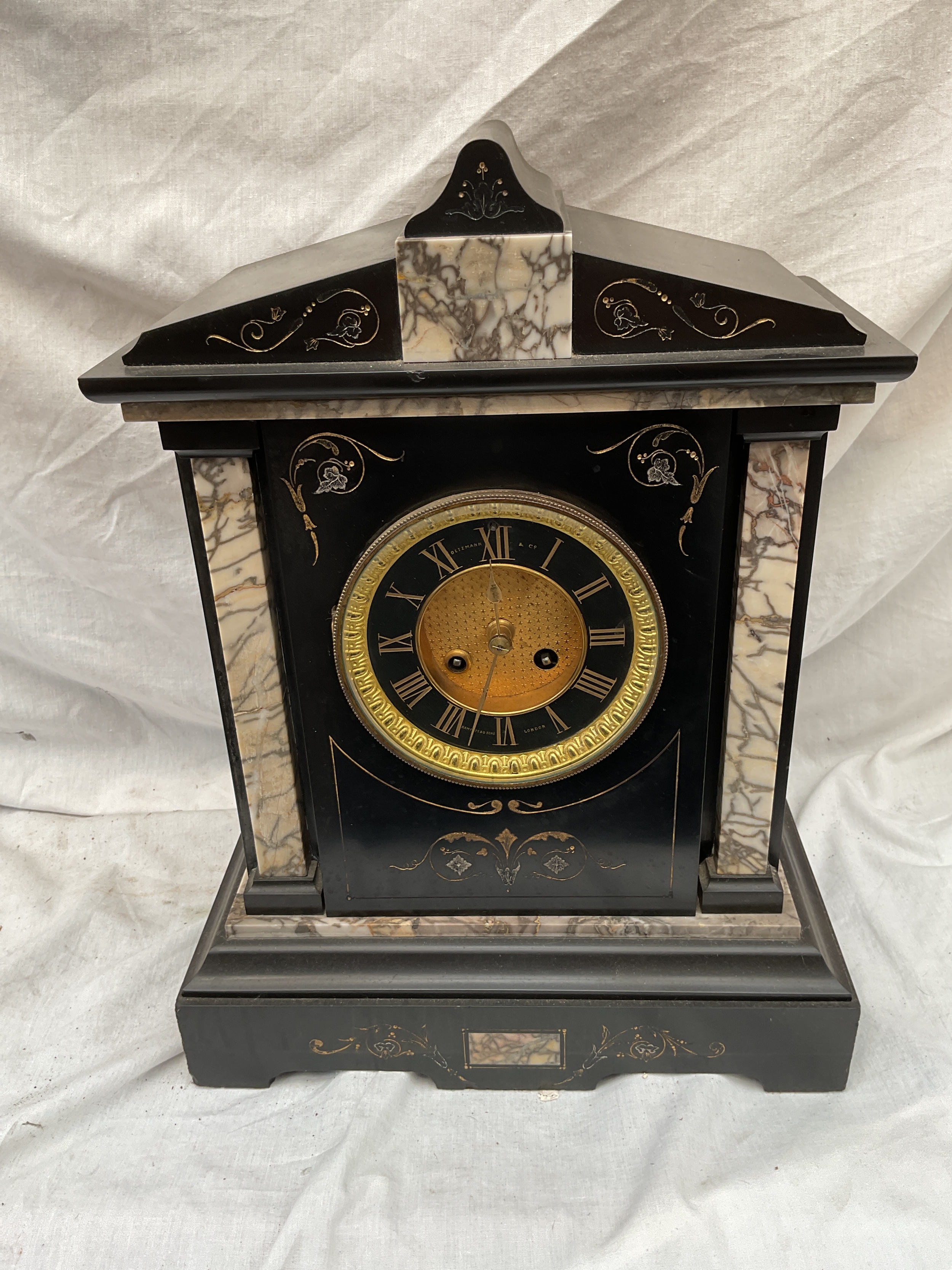 19 th c slate mantle clock in architectural style.Oetzmann and Co retailed.