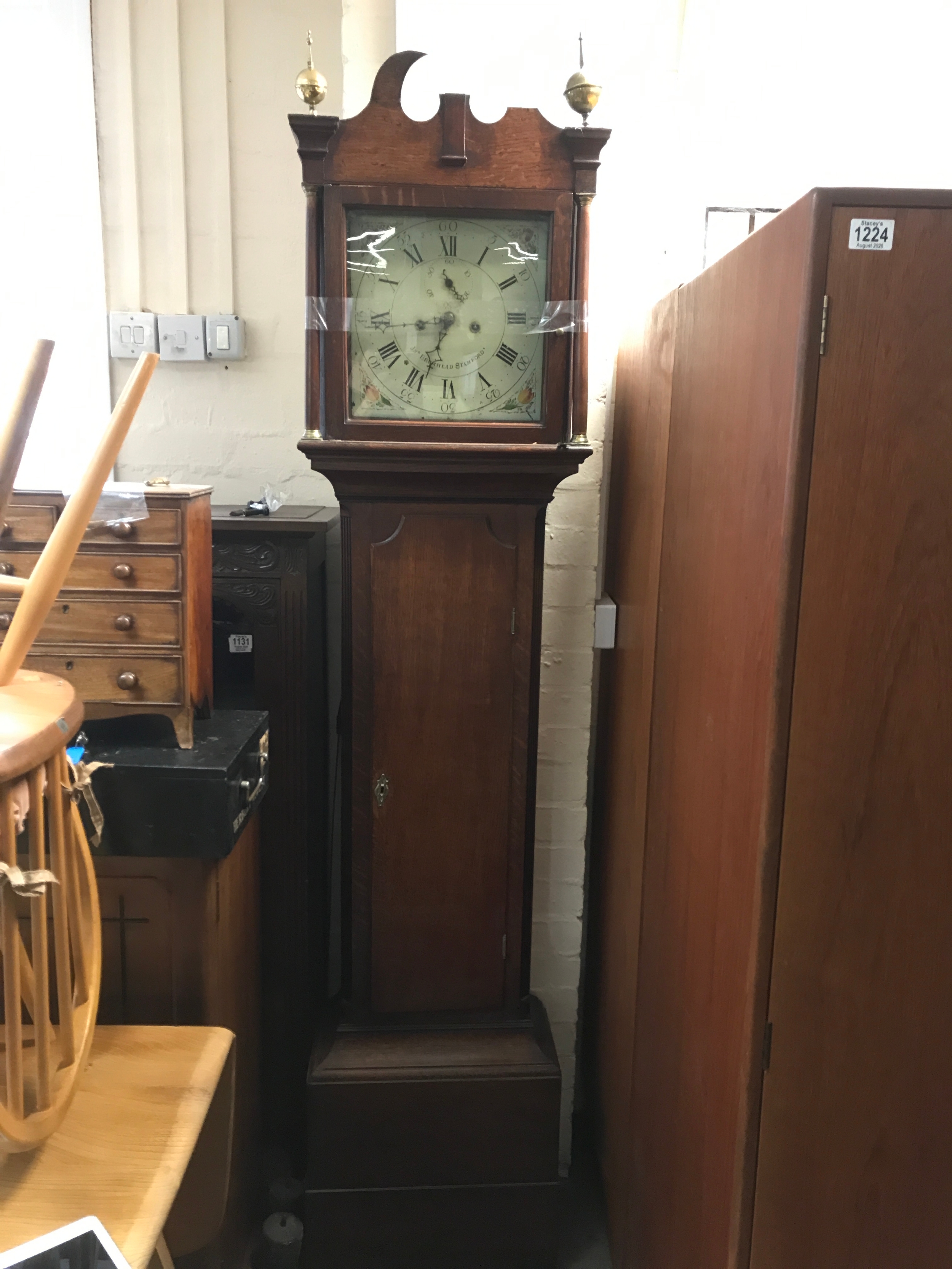An oak longcase grandfather clock, Brumhead Stamford. With pendulum and weights 208cm tall 46cm wide