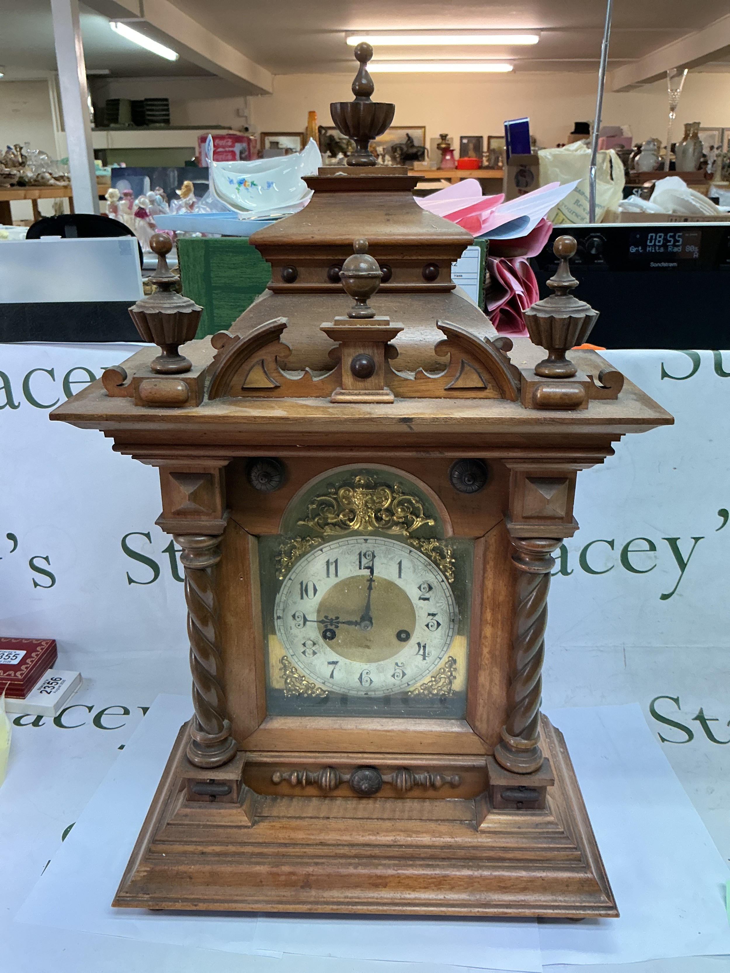 A walnut cased eight day mantle clock with Arabic numerals, approx height 61.5cm. TO BE SOLD WITHOUT RESERVE