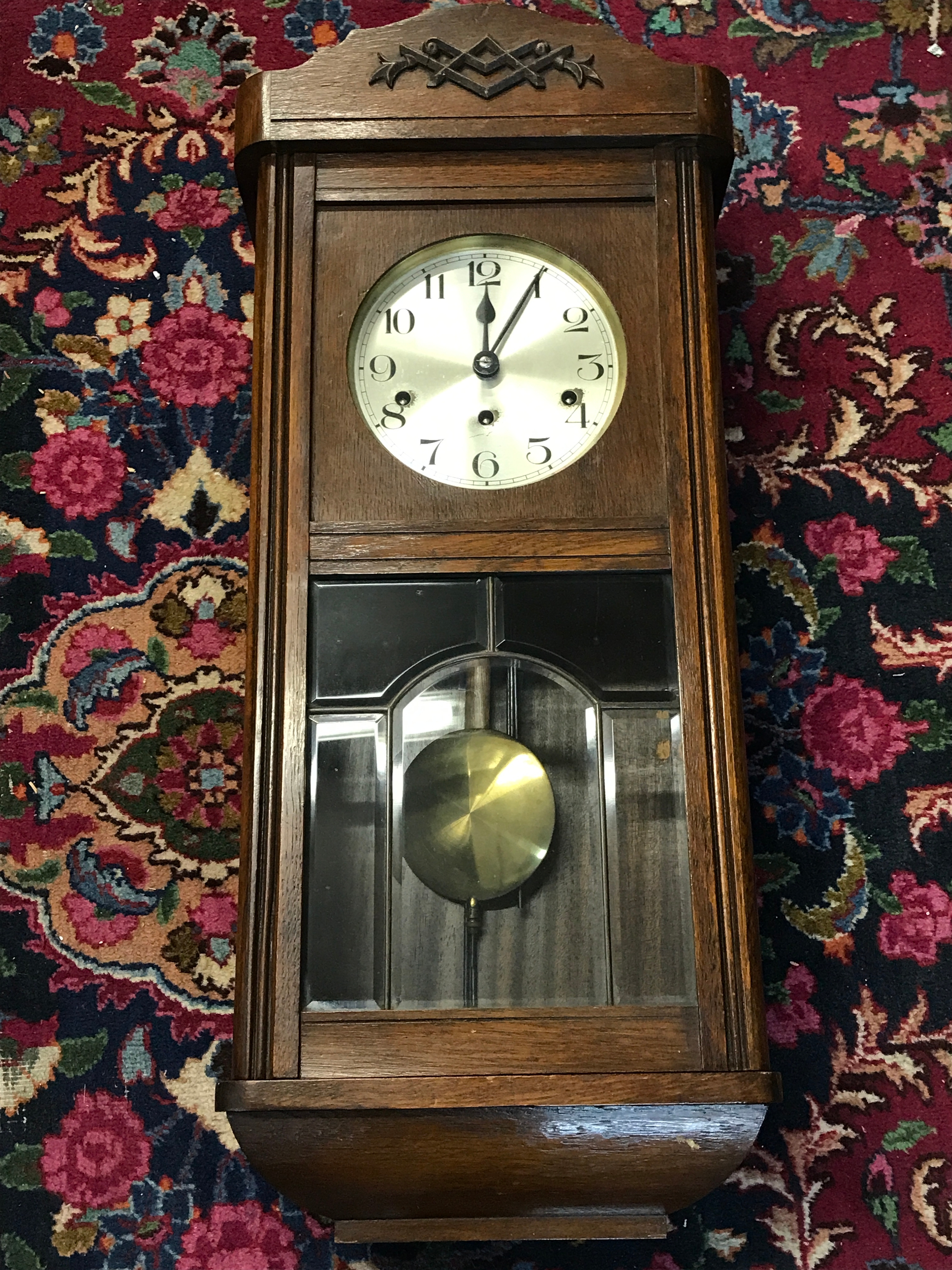 An oak cased wall clock 78cm tall, 30cm wide, 16cm long. With key TO BE SOLD WITHOUT RESERVE
